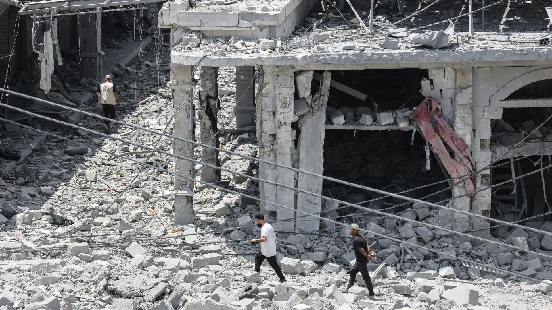 People make their way through the heavily damaged historic market of Nabatieh as residents displaced by fighting return to southern Lebanon on June 15, 2026. Israel's defence minister said on June 15, that Israeli forces would remain in Lebanon, Syria and Gaza indefinitely, hours after the United States and Iran agreed to end the Middle East war, including in Lebanon. MAHMOUD ZAYYAT / AFP