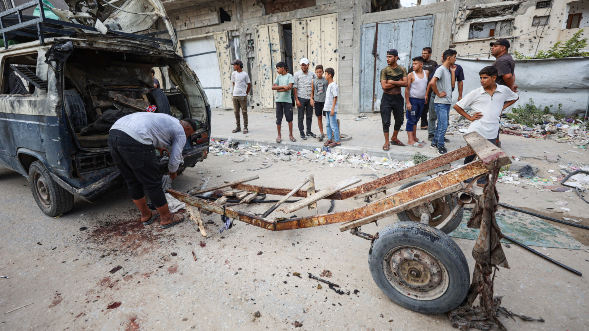 The strike hit a cart attached to a minibus used to transport passengers amid severe fuel shortages and soaring transport costs (Omar al-Qattaa/AFP)