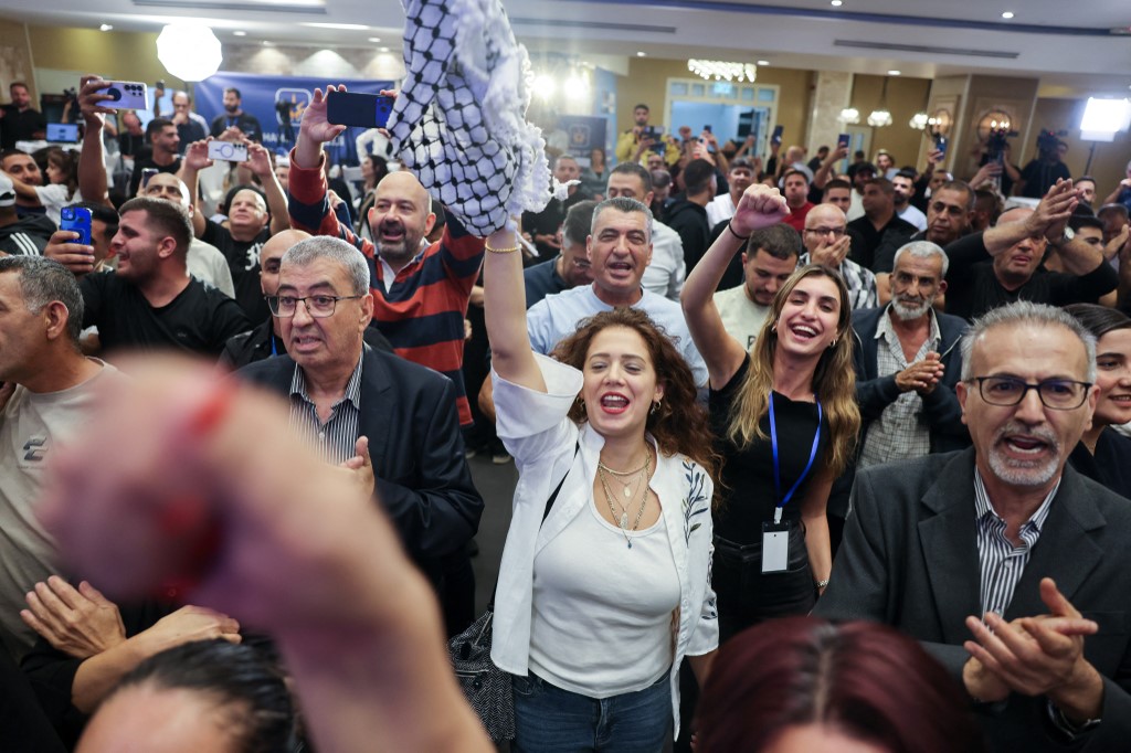 Supporters of Israel's Palestinian-led Joint List political alliance cheer at the alliance's campaign headquarters in the northern Israeli city of Nazareth on October 27, 2026