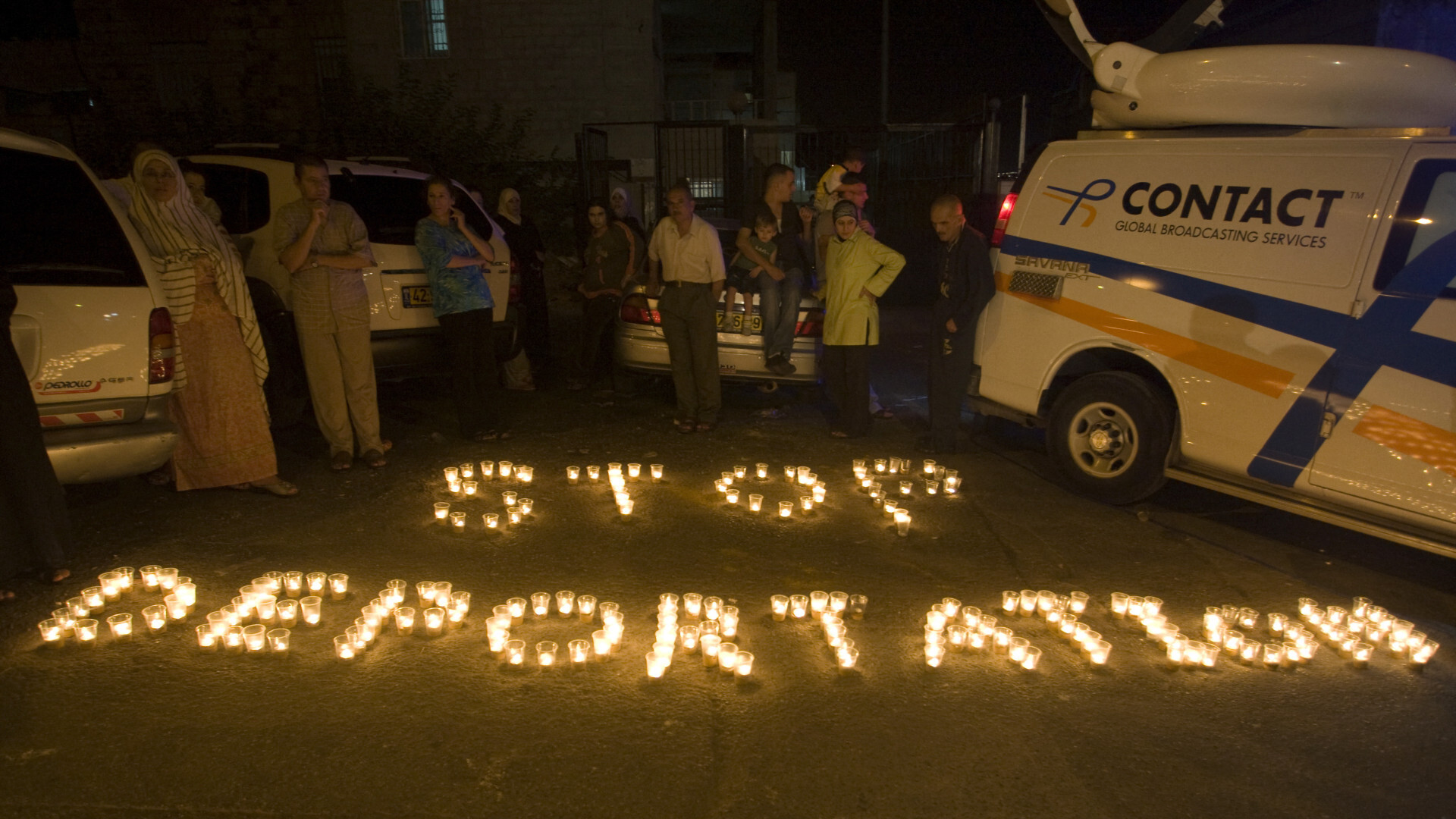 Palestinians hold protest in East Jerusalem on 13 July, 2010, after Israel announced three Hamas members of the Palestinian Legislative Council would be stripped of their residency rights (AFP)