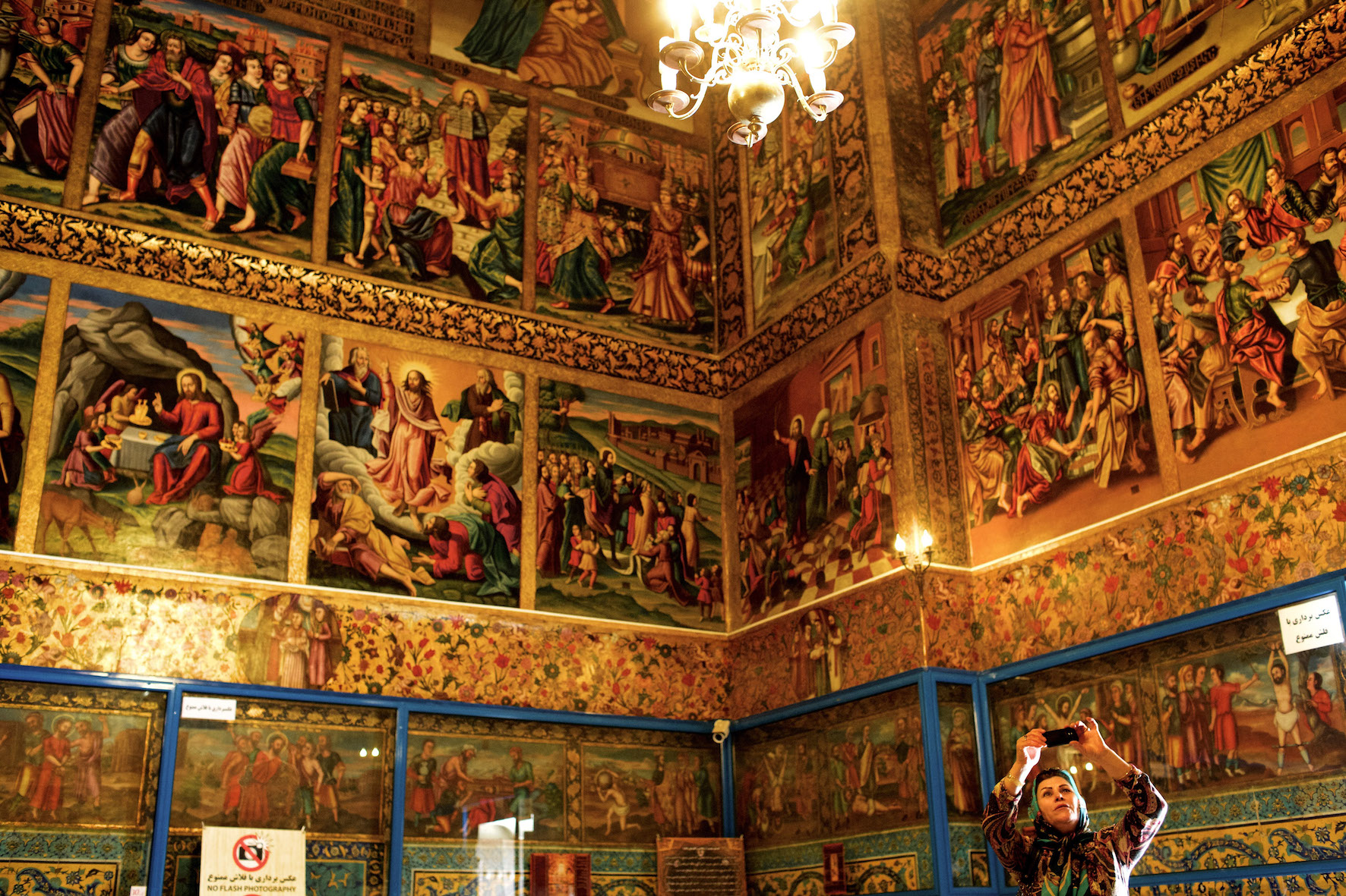 An Iranian Muslim tourist take pictures inside Vank cathedral in the Julfa neighbourhood of the historic city of Isfahan (Behrouz Mehri/ AFP)