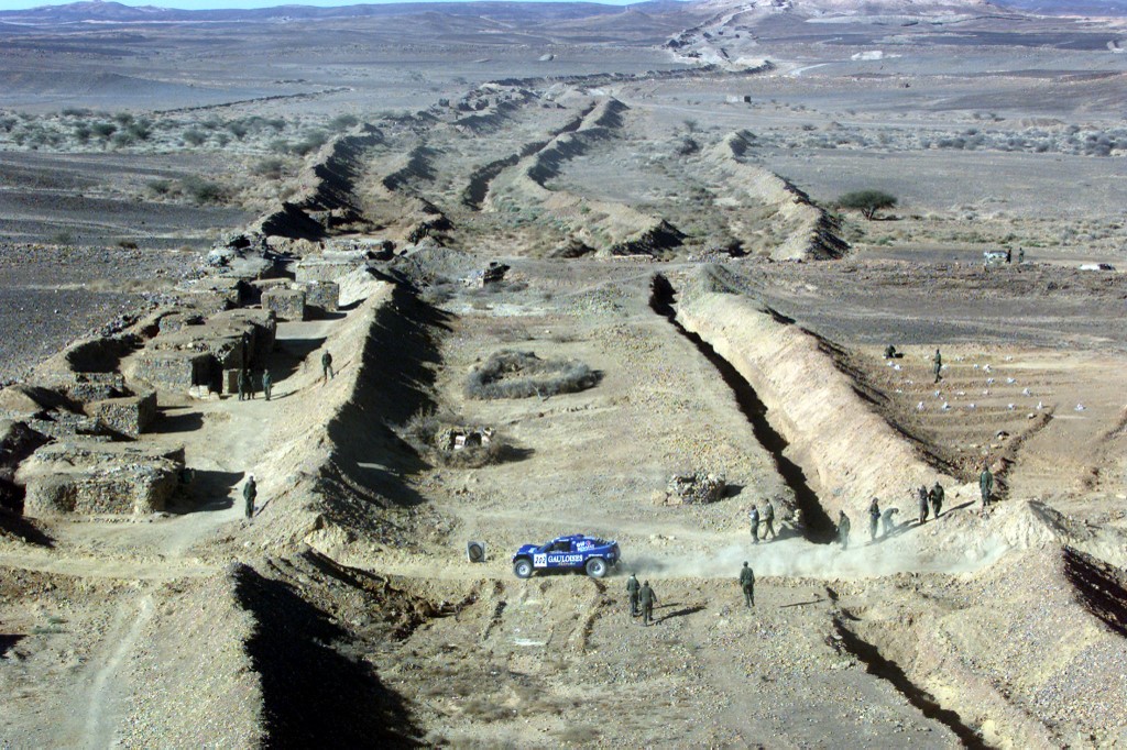 A 2,700km wall separates Moroccan from Sahwari claimed territory in Western Sahara (AFP)