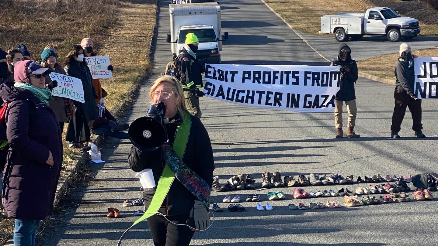 Rev Margaret Ernst leads a memorial service for those killed in Gaza, as activists block the road to a subsidiary of the Israeli arms manufactuer Elbit Systems in Pennsylvania.