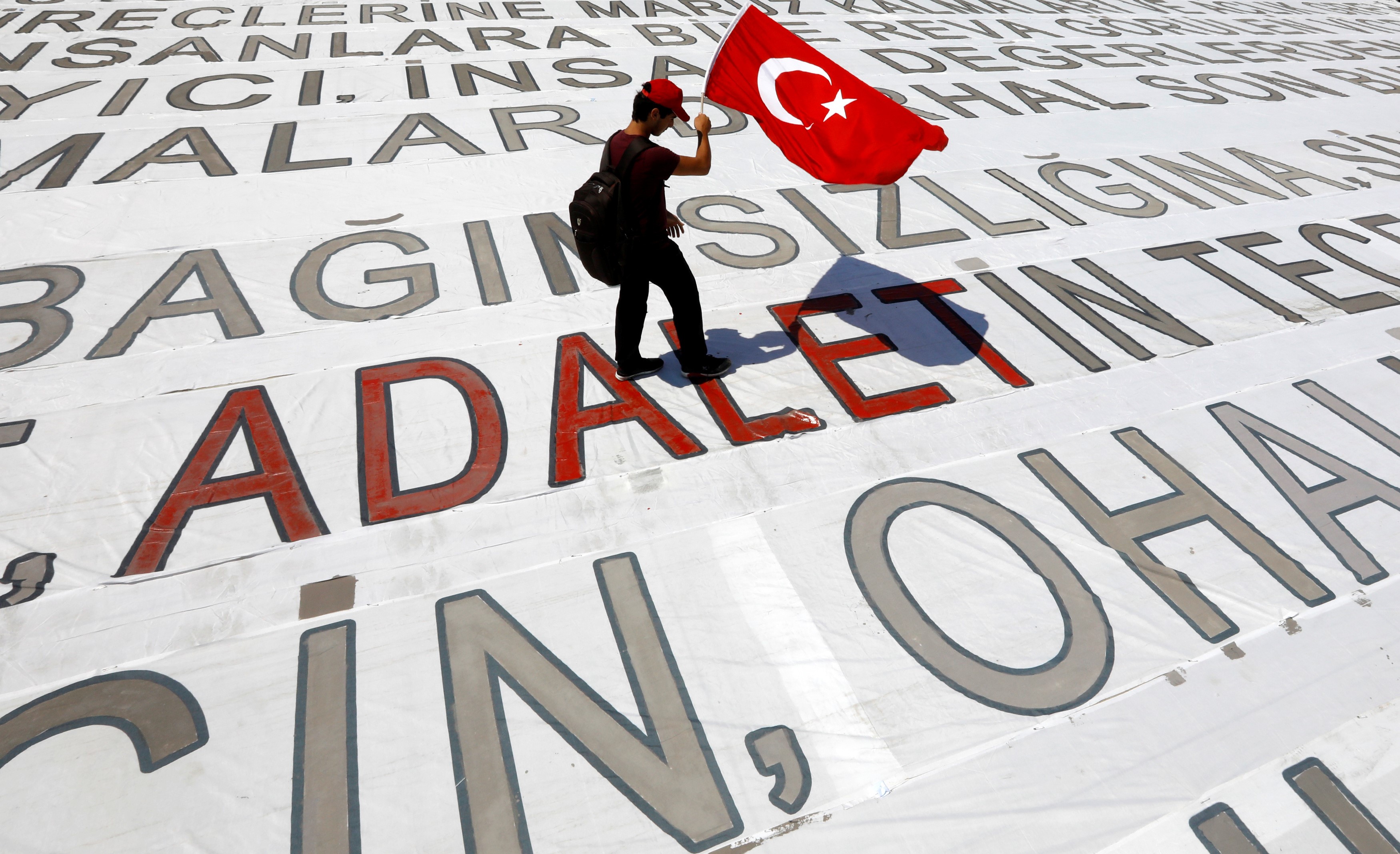 A young man with a Turkish flag during a rally dubbed 