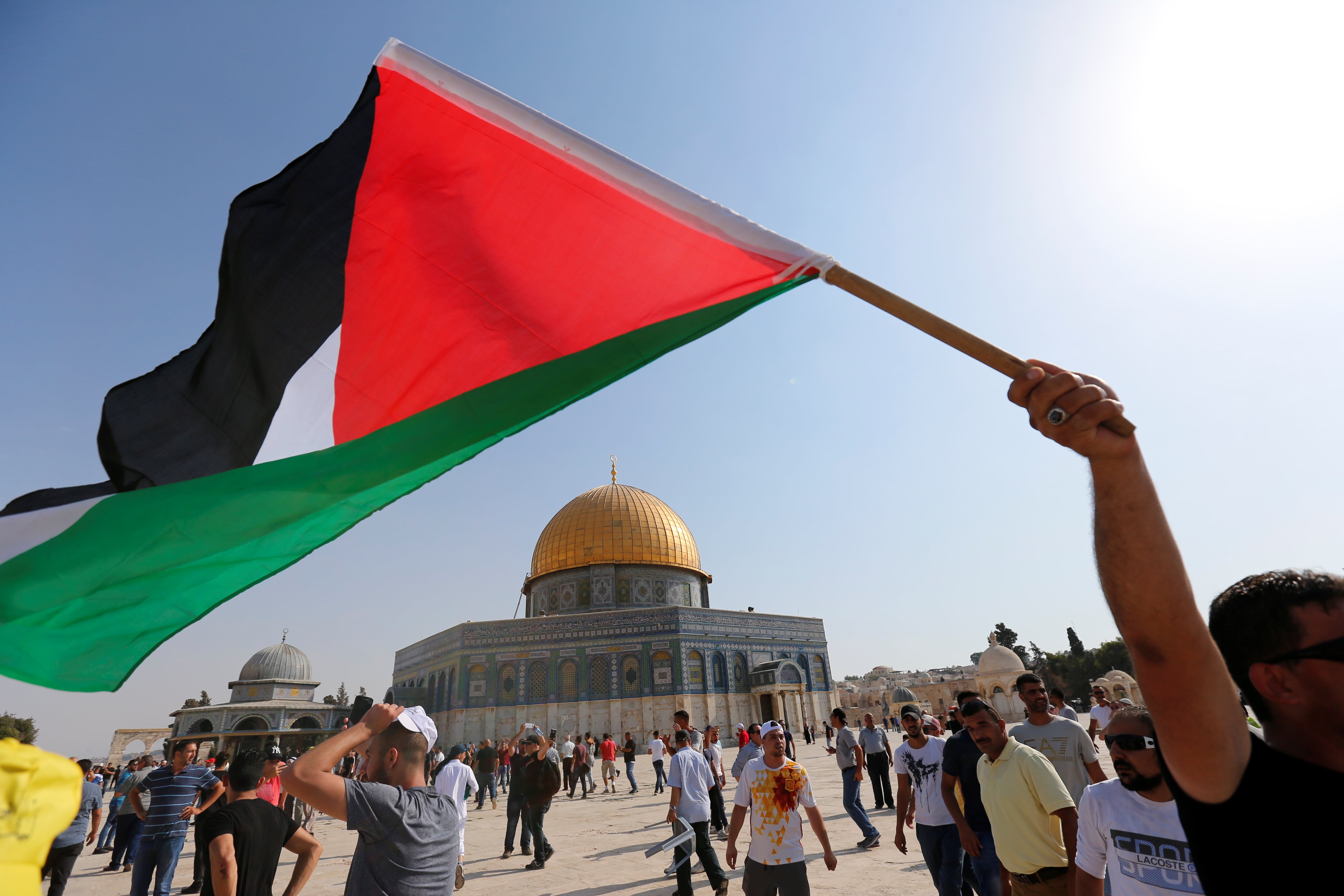 A man waves a Palestinian in al-Aqsa Mosque. (Reuters/file)