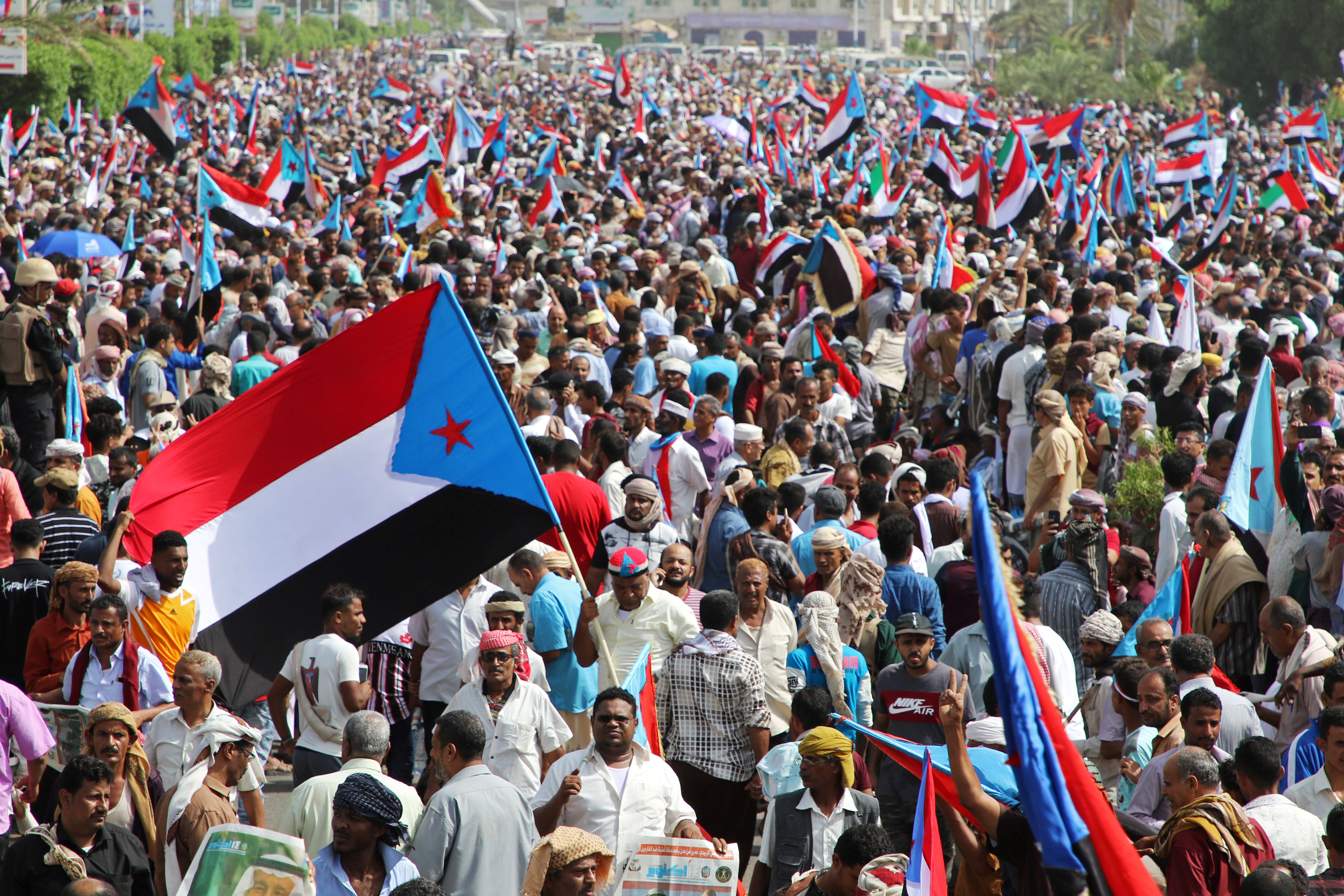 Supporters of Yemen's UAE-backed southern separatists march during a rally in southern port city in Aden (Reuters)