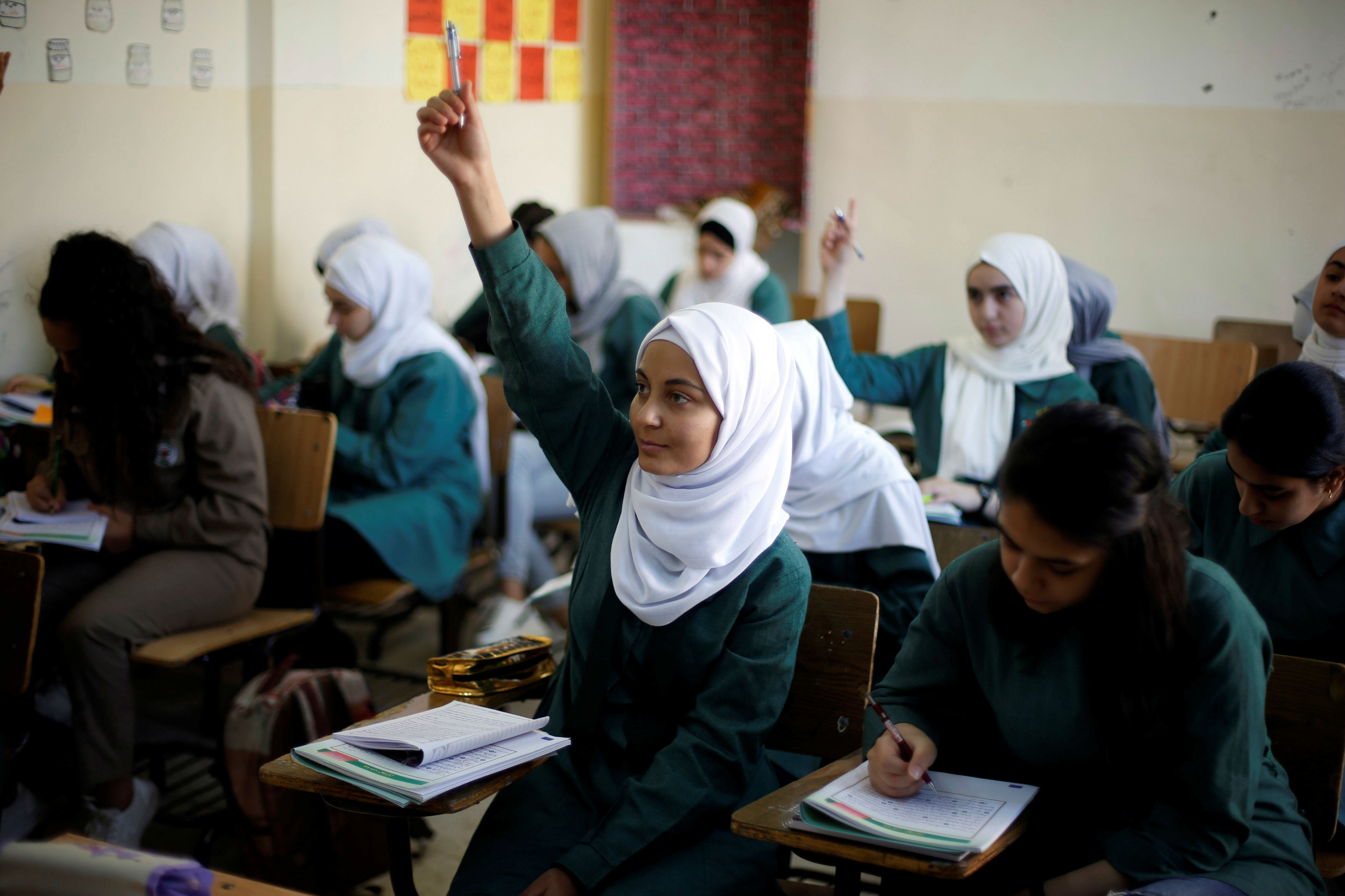 Students attend a class at one of the public schools during the first day after the end of teachers' one-month strike in Amman (Reuters)