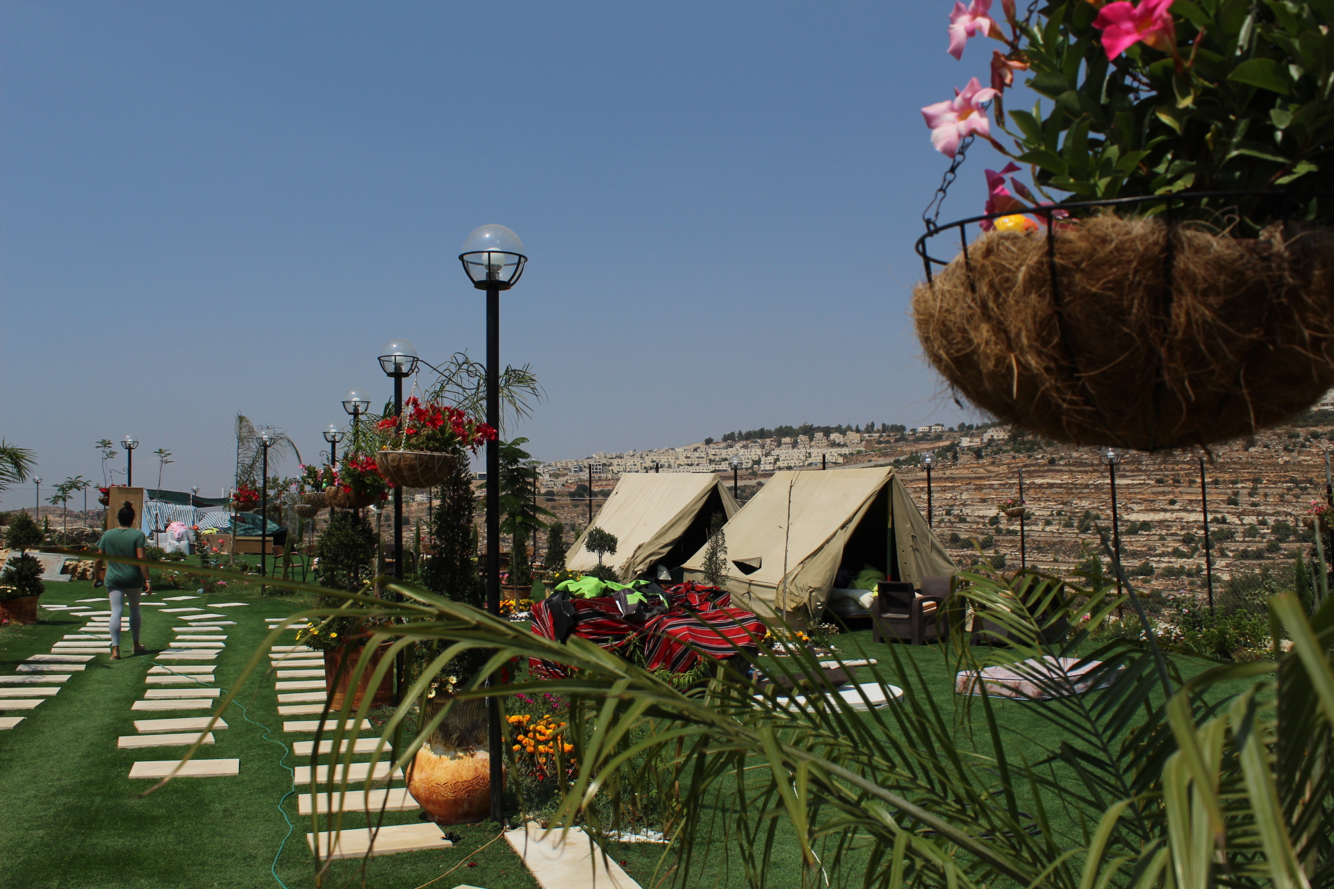 Tents set up in the remnants of the Palestinian family's home and restaurant (MEE/Megan Giovannetti)