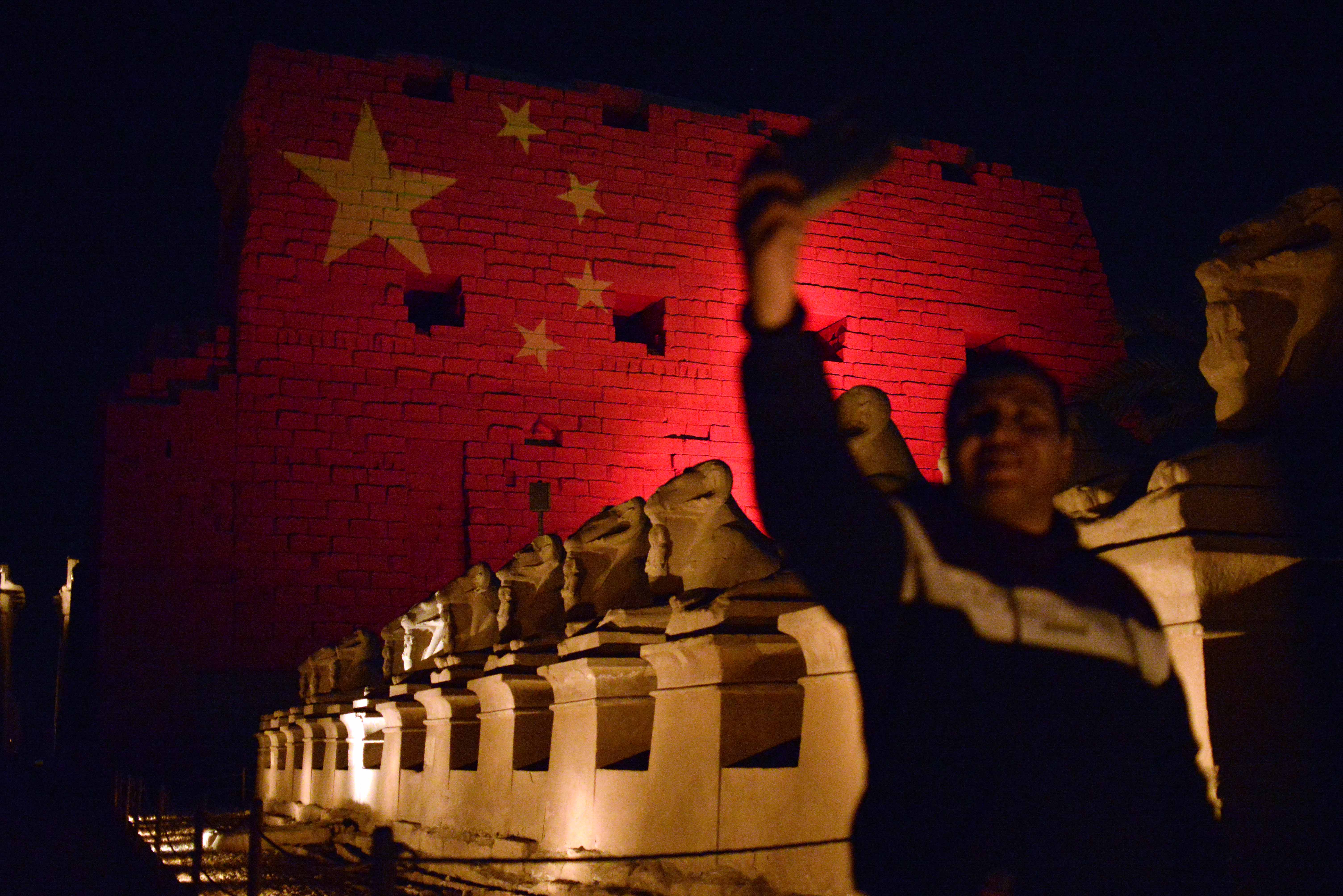The Saladin Citadel in Cairo illuminated in red and gold stars to resemble the national flag of China as a sign of solidarity in the fight against the new coronavirus on 1 March (Reuters)