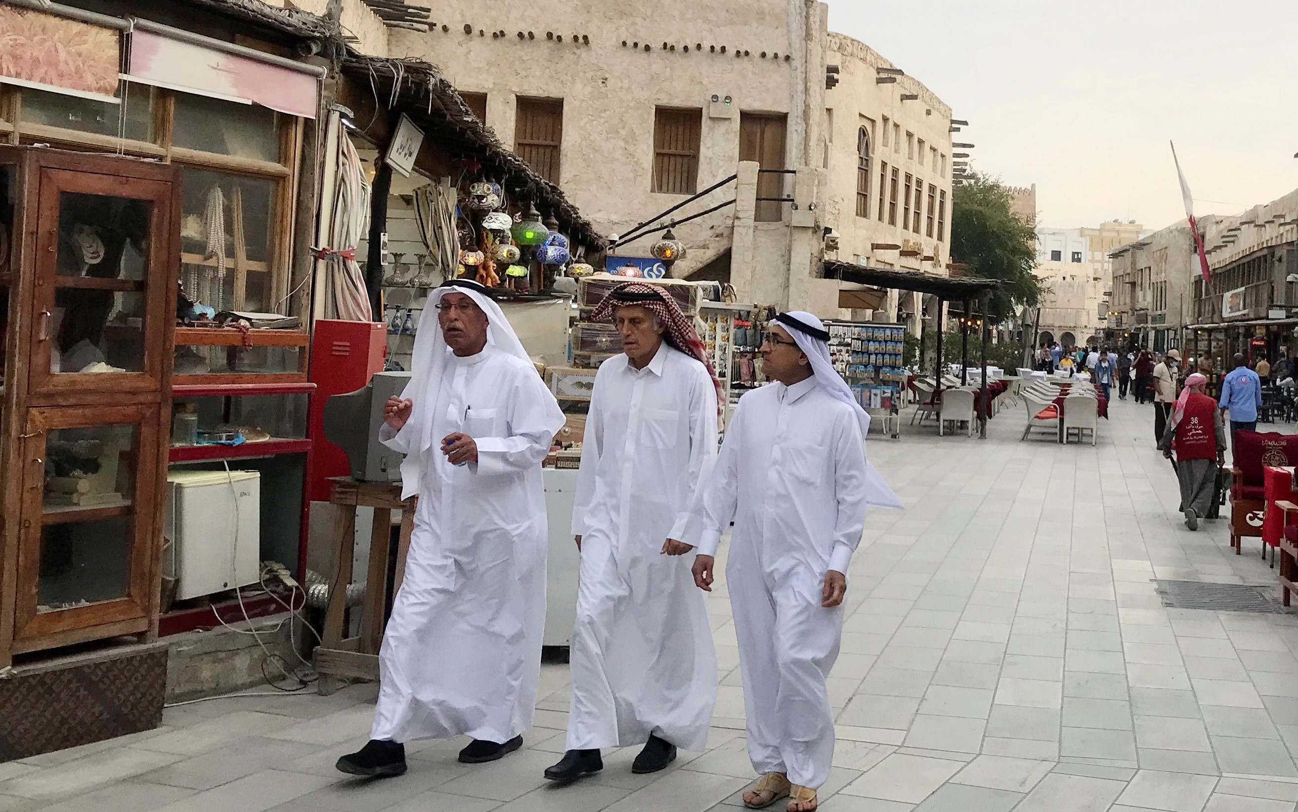 People walk at Souk Waqf following the outbreak of coronavirus in Doha (Reuters)