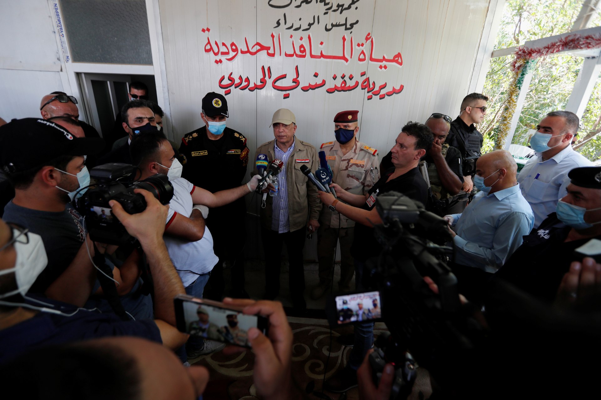 Iraqi Prime Minister Mustafa al-Kadhimi speaks to the media at Mandali border crossing between Iraq and Iran (Reuters)