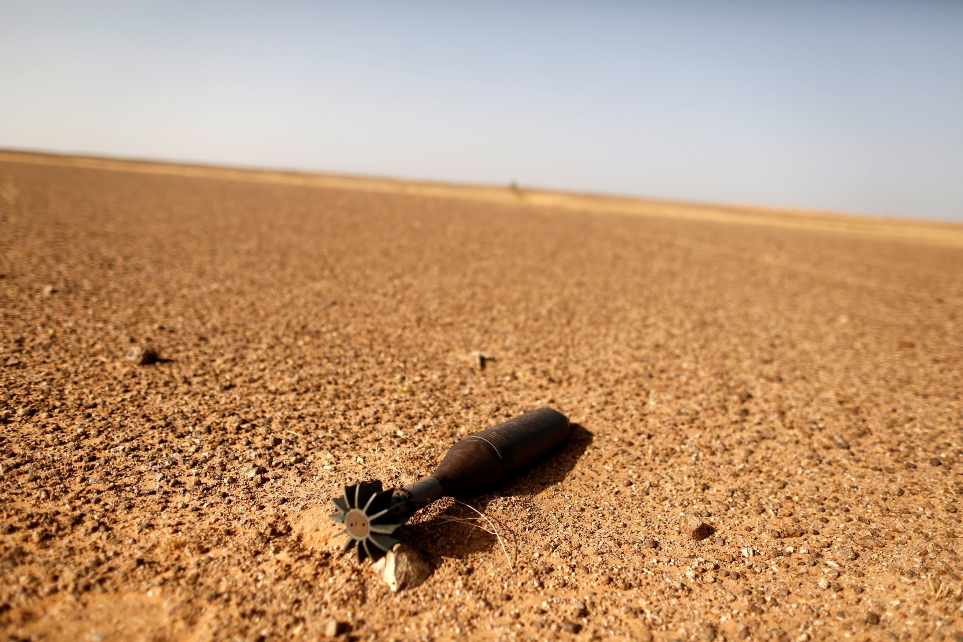 A rocket is pictured near an earth wall that separates areas controlled by Morocco and the Polisario Front in Western Sahara (Reuters)