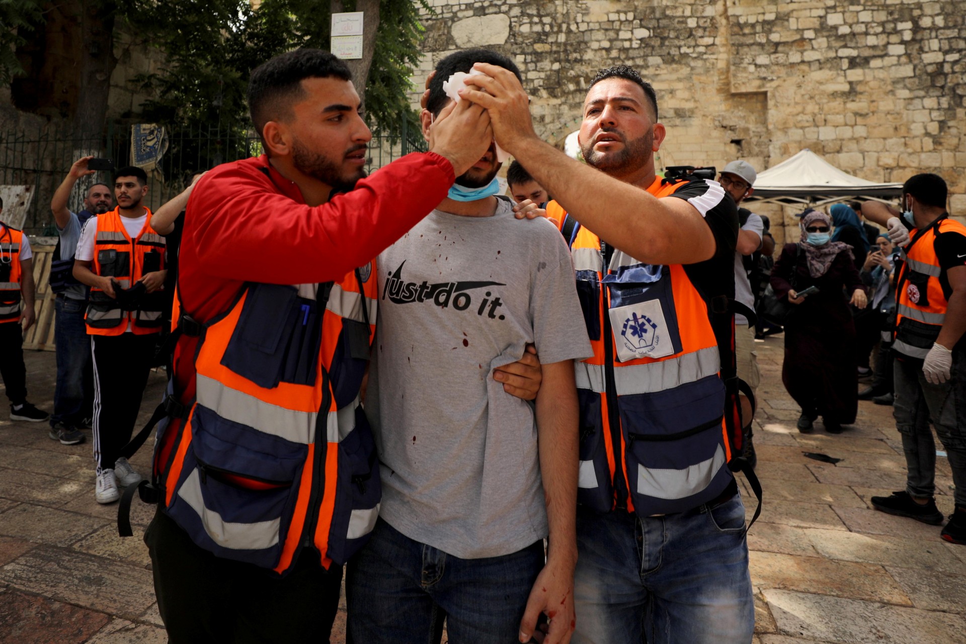 Medics tend to a wounded Palestinian (Reuters)
