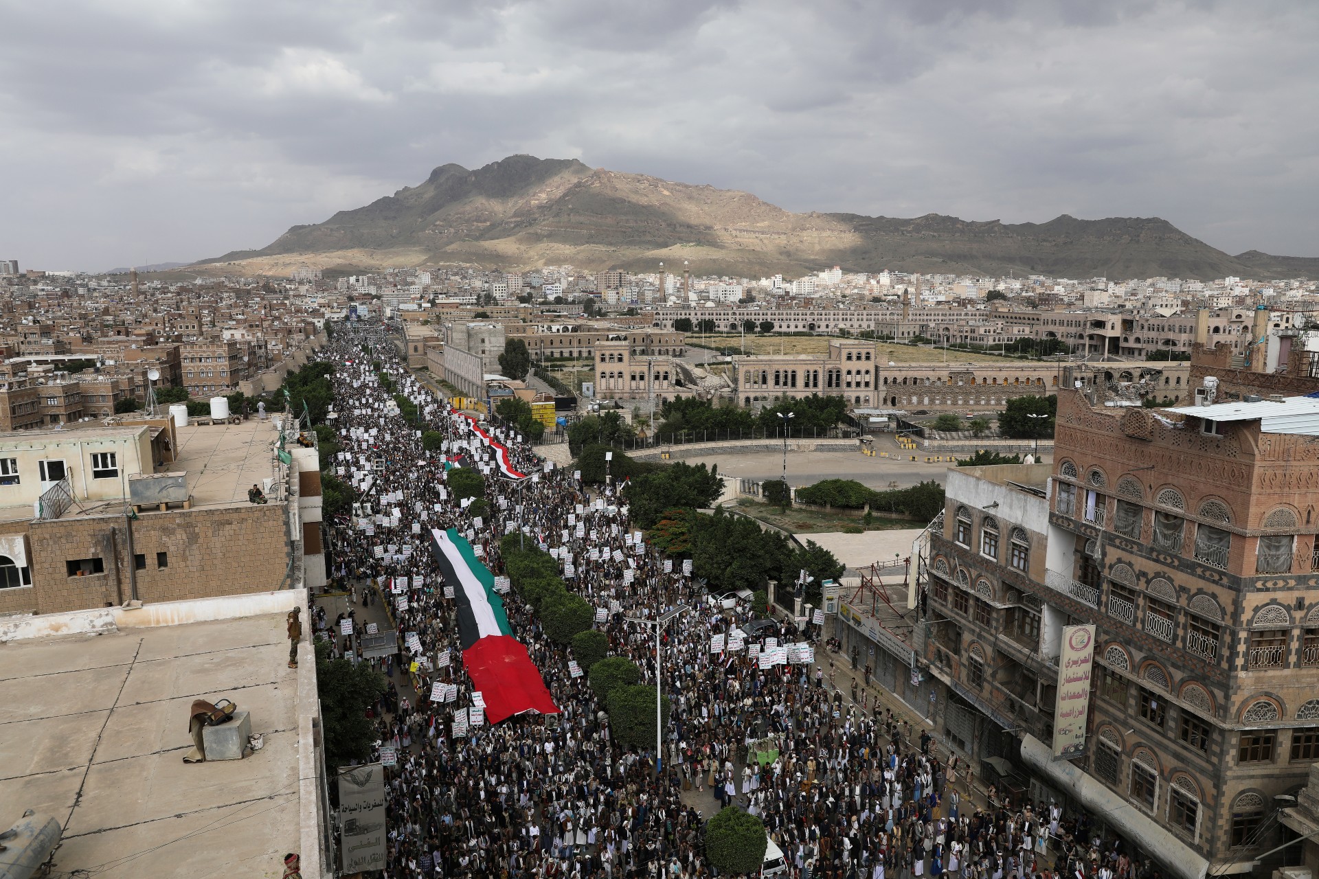 People gather during a protest to express solidarity with the Palestinian people amid a flare-up of Israeli-Palestinian violence, in Sanaa, 17 May (Reuters)