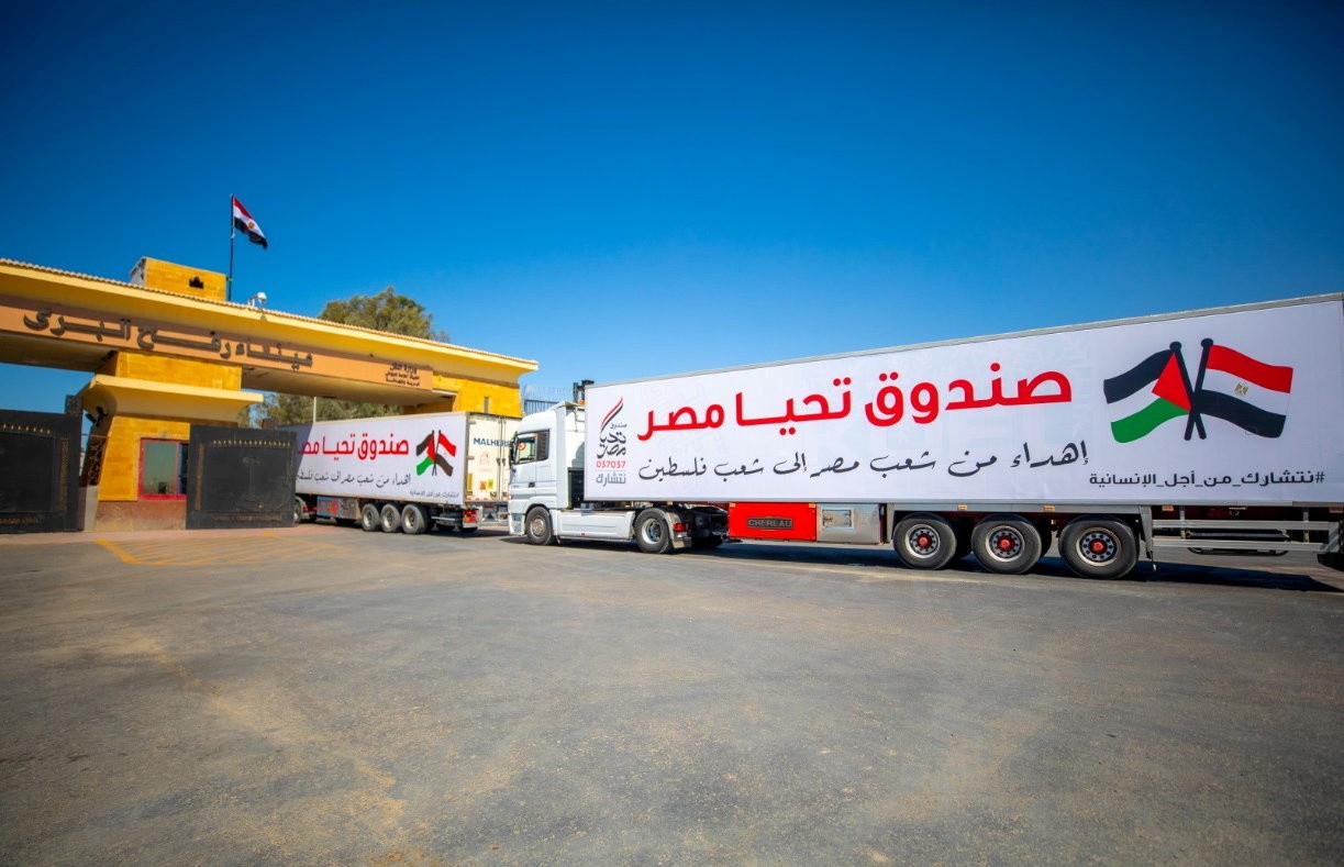 An aid convoy's trucks loaded with supplies send by Long Live Egypt Fund are seen at the Rafah crossing between Egypt and the Gaza Strip on May 23 (Reuters)