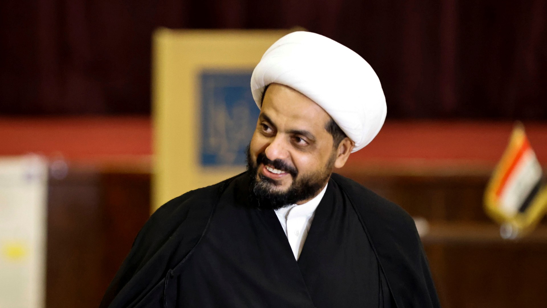 Qais al-Khazali, leader of Asaib Ahl al-Haq, gestures after casting his vote in the parliamentary election, in Iraq in 2021 (Reuters)
