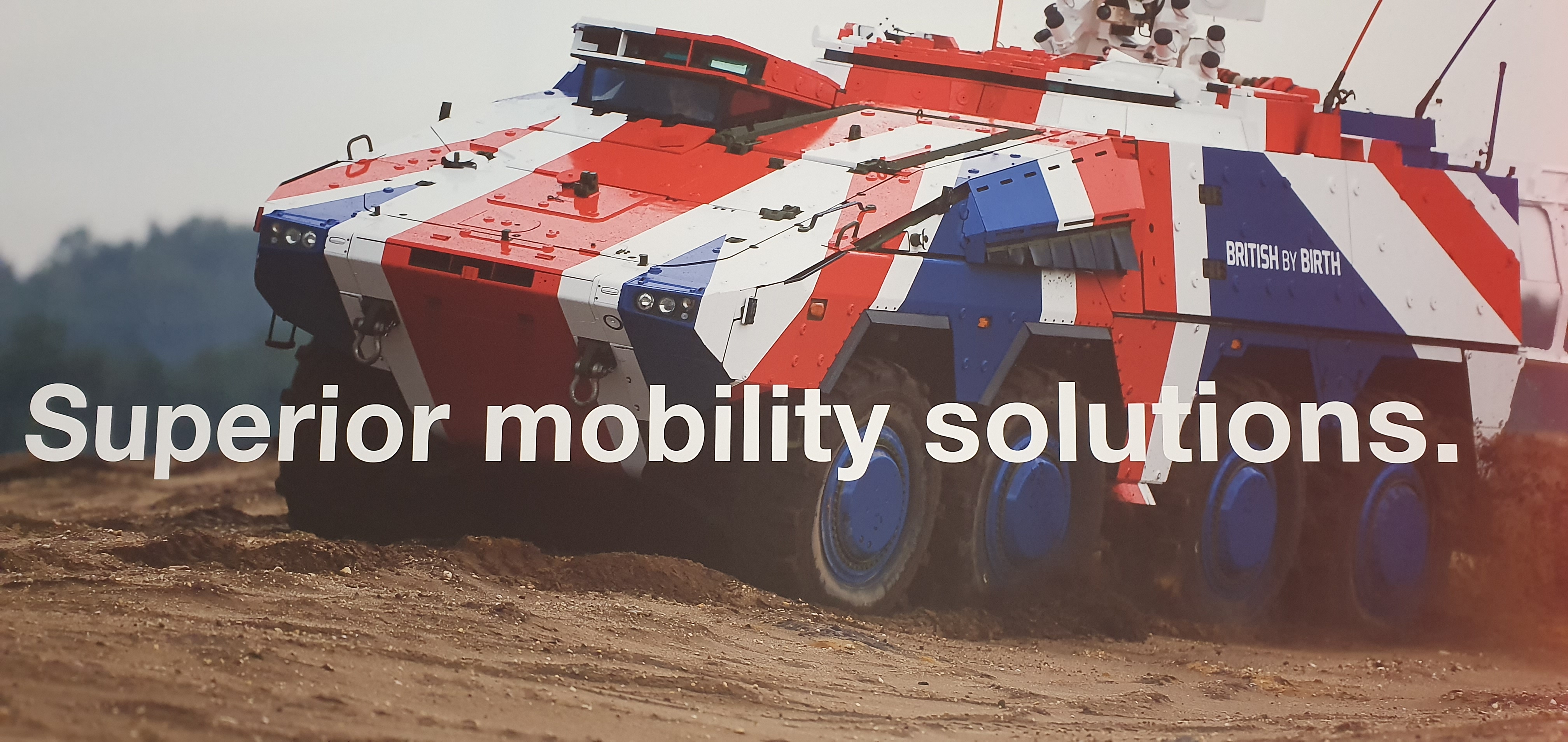 A tank in the colours of the union jack that reads 'British by Birth'