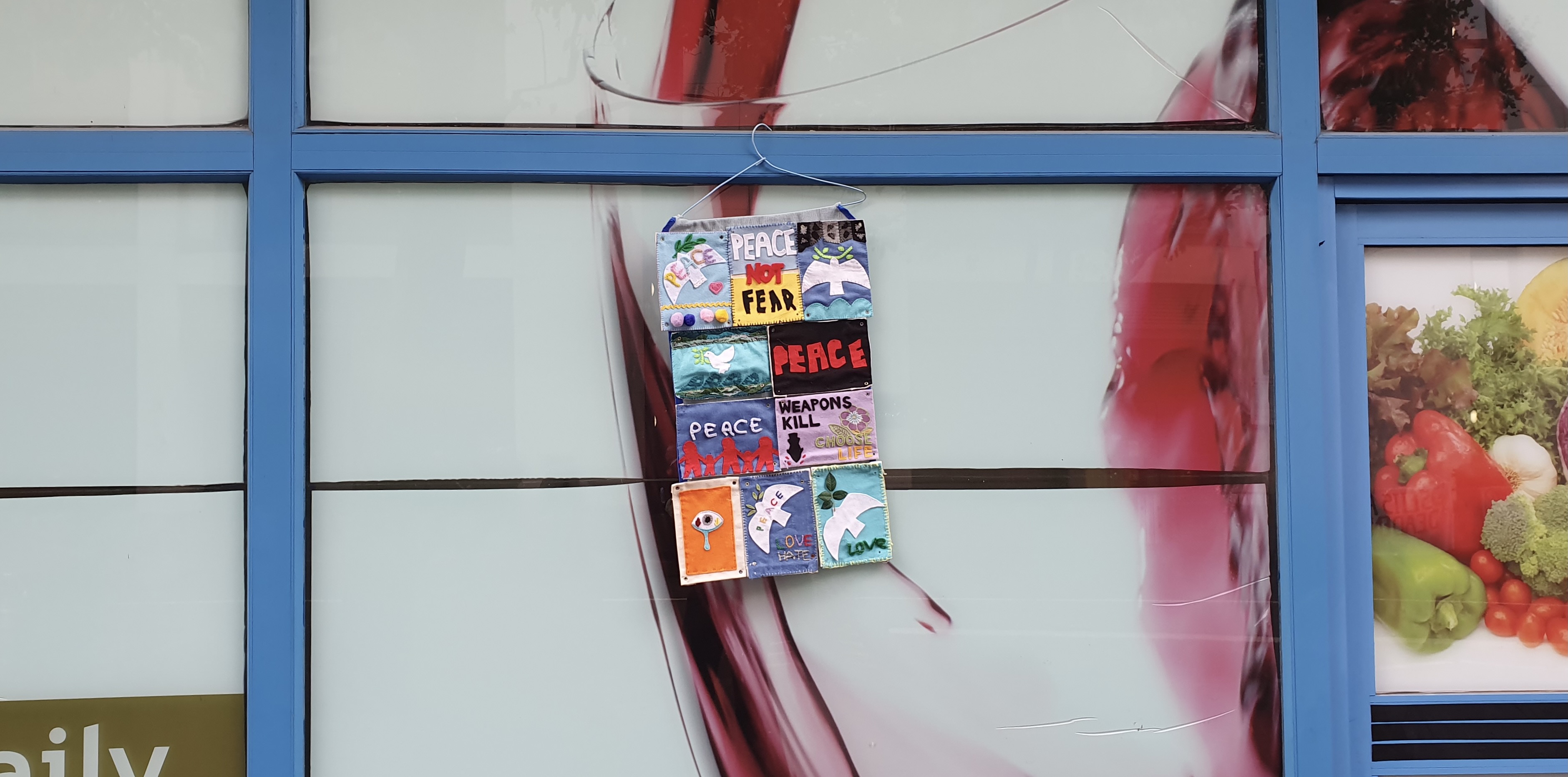 A sign left over from the day's protest hangs outside a shop near the Excel centre
