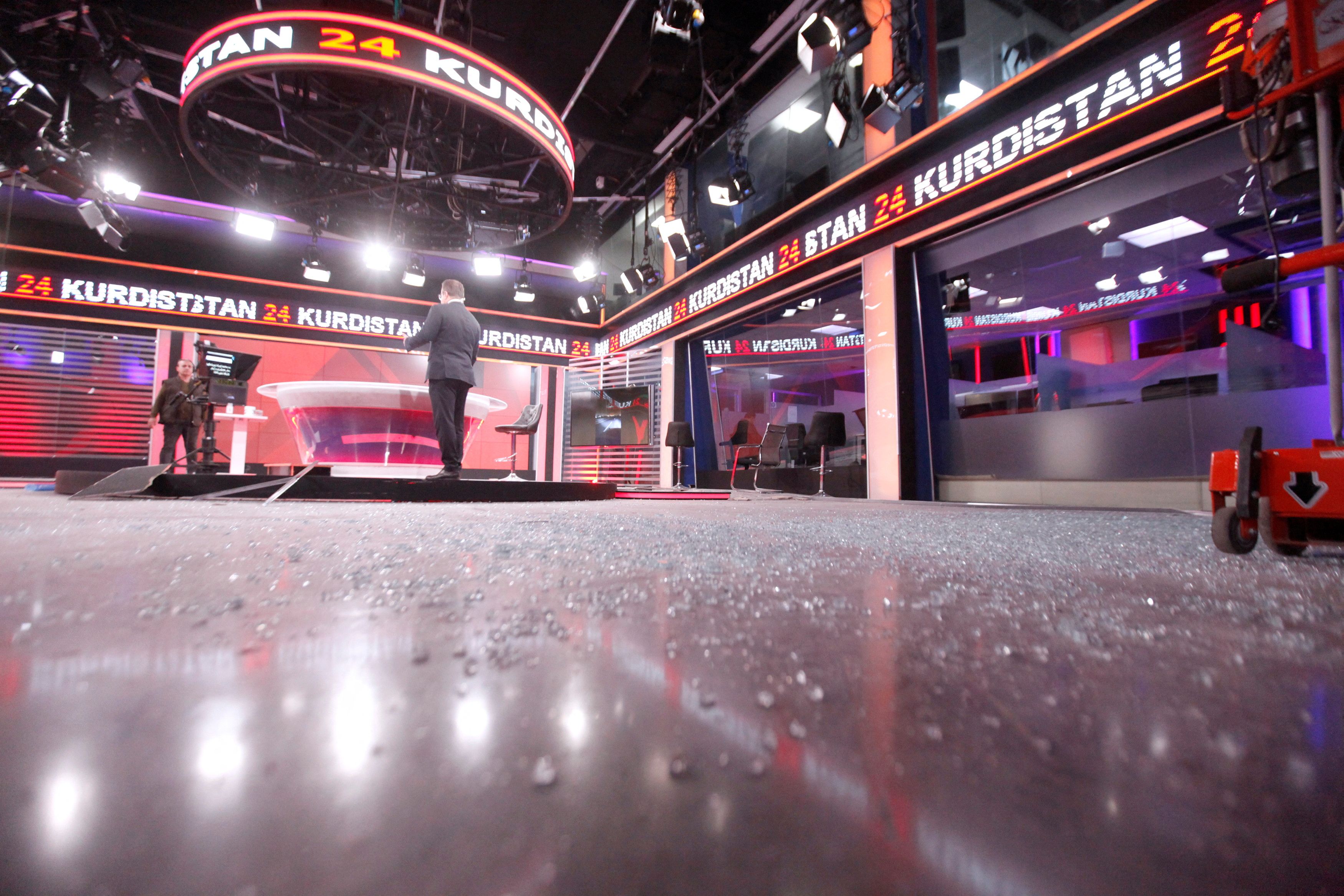 View of the damaged studio at the Kurdistan 24 TV building, as staff work, after a ballistic missiles attack nearby in Erbil (Reuters)