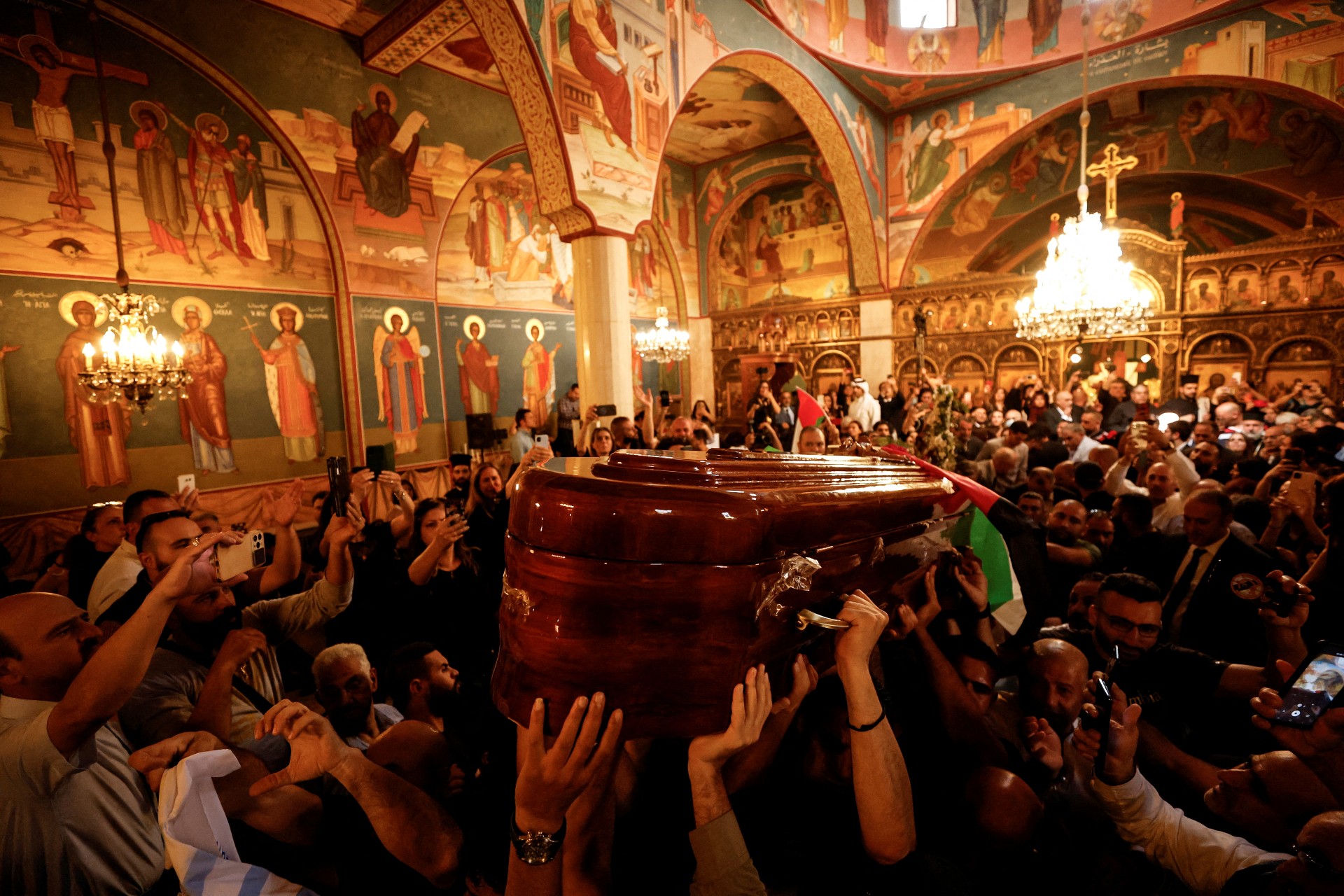 Family and friends carry the coffin of Al Jazeera reporter Shireen Abu Akleh during her funeral in a church in Jerusalem (Reuters)
