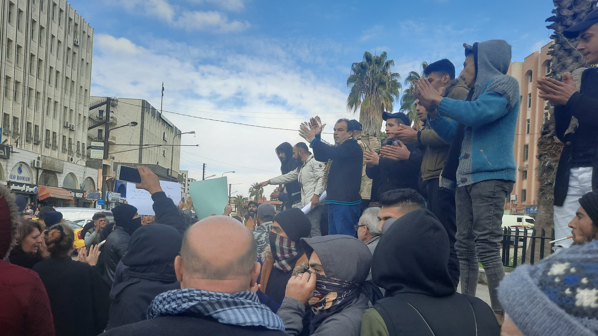 People gather as they take part in a protest in Sweida on 4 December (Reuters)