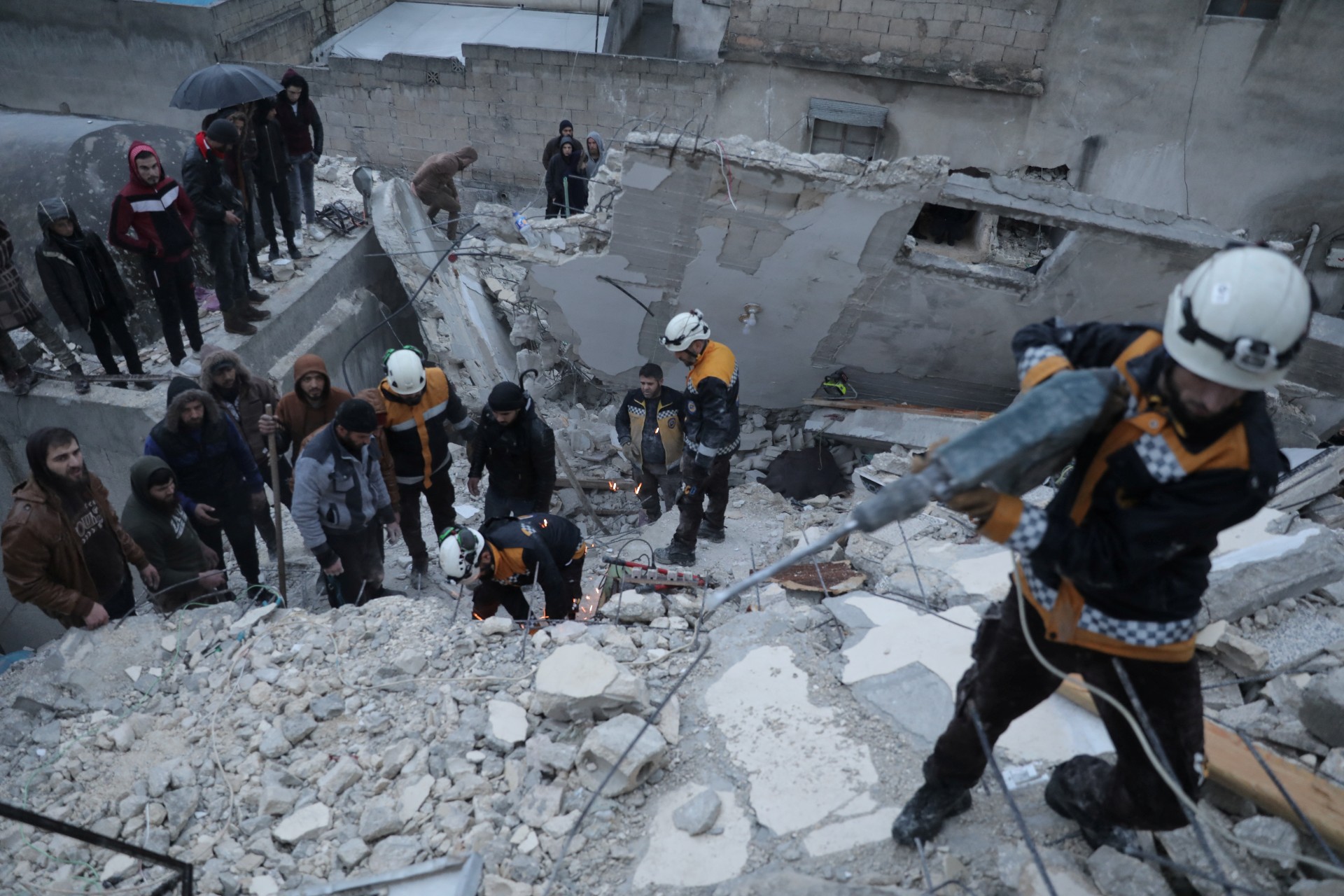 Rescuers search for survivors under the rubble following an earthquake in rebel-held Idlib, Syria (Reuters)