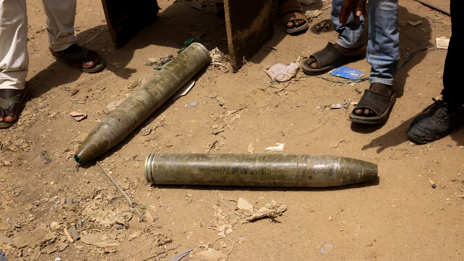 Shells are seen on the ground near damaged buildings at the central market during clashes between the paramilitary Rapid Support Forces and the army in Khartoum North, 27 April (Reuters)