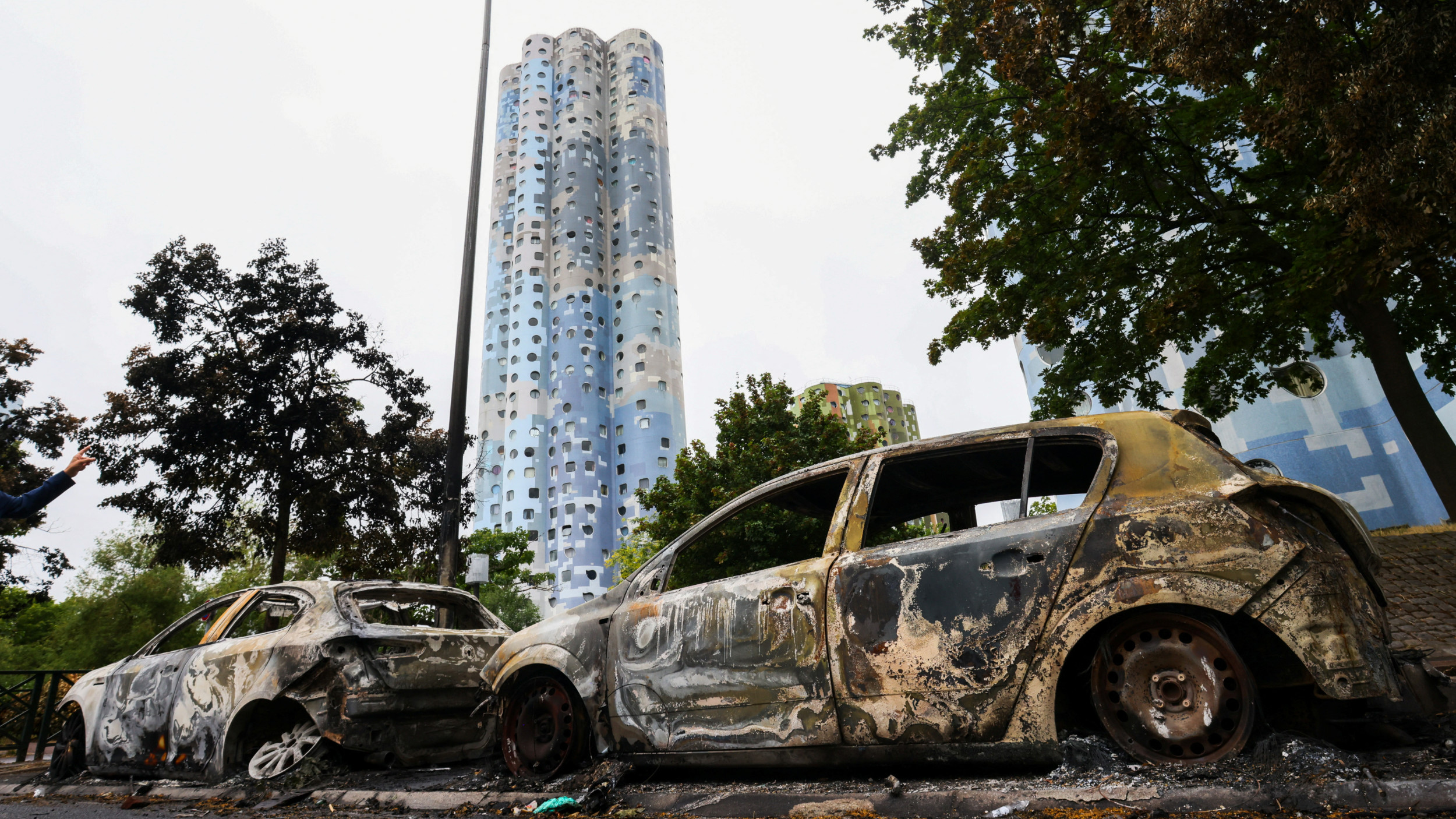 A view of cars burnt during a night of clashes between protesters and police in Nanterre, Paris on 2 July 2023 (Reuters) 