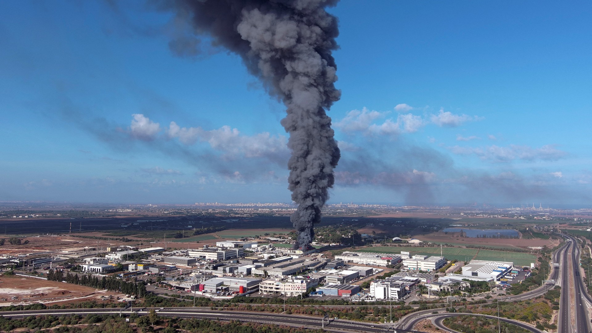 Smoke is seen in the Rehovot area as rockets are launched from the Gaza Strip (Reuters)