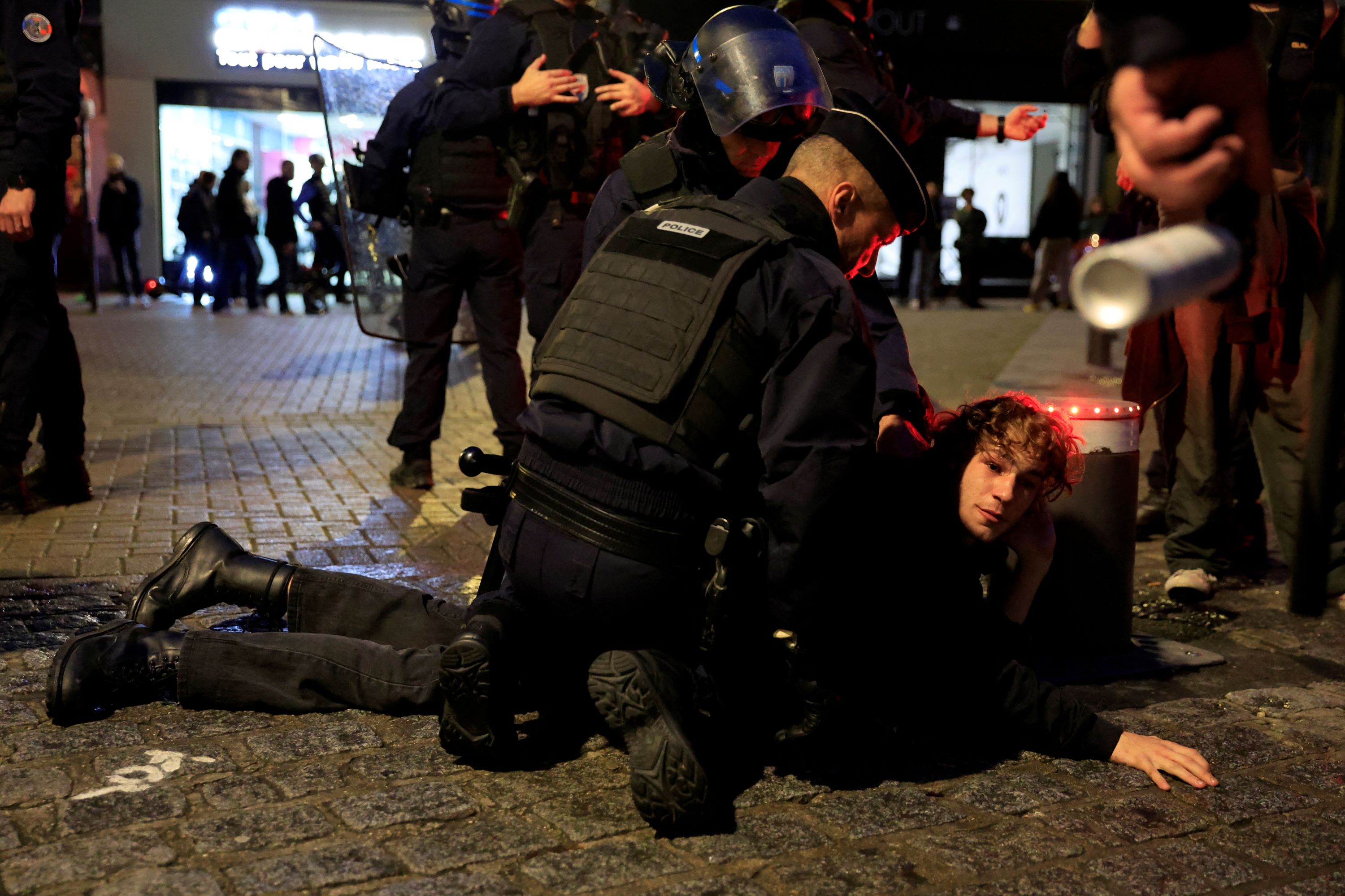 French police apprehend a protester during an unauthorized demonstration in support of Palestinians, as part of the ongoing conflict between Israel and Hamas, in Lille (Reuters)