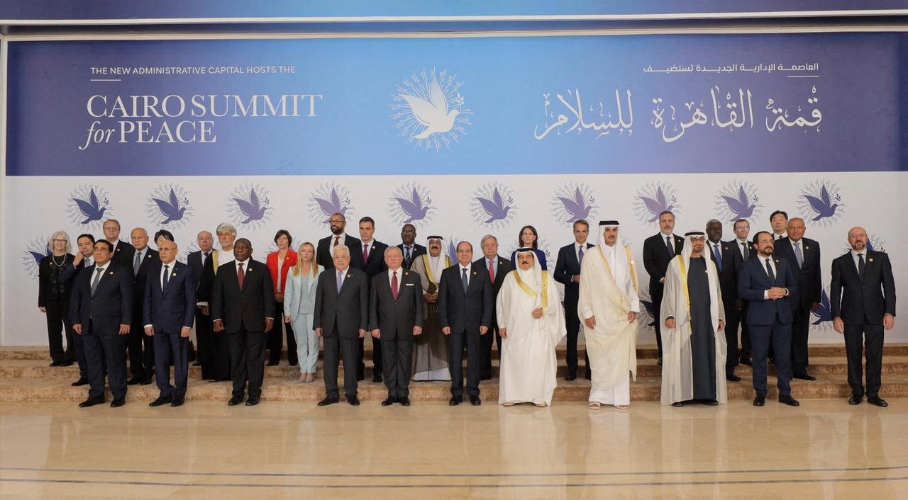 Leaders pose for a family photo before the Cairo international summit for peace east of Cairo, Egypt, 21 October 2023 (Reuters)