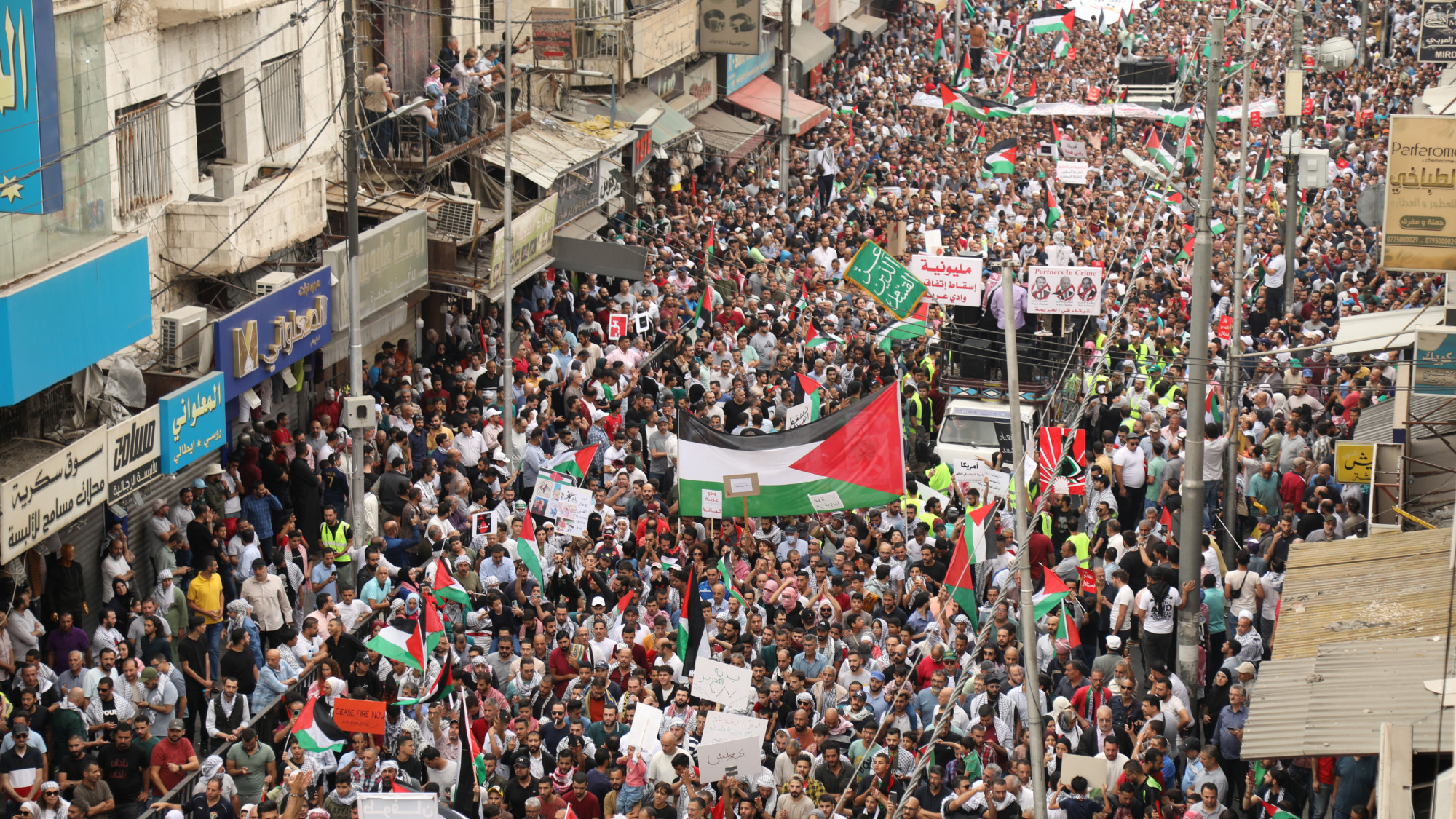 Jordanians gather during a protest in support of Palestinians in Gaza in Amman on 27 October (Reuters)
