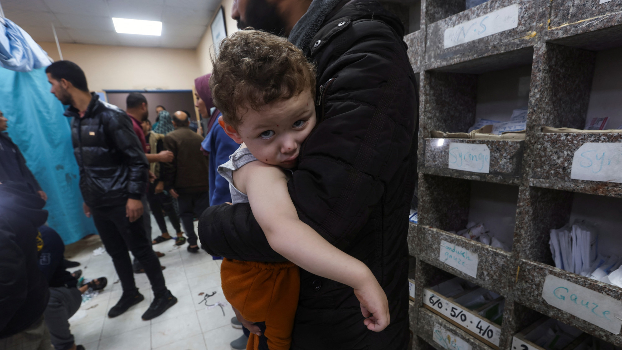 A Palestinian child looks on at Nasser hospital (Reuters)