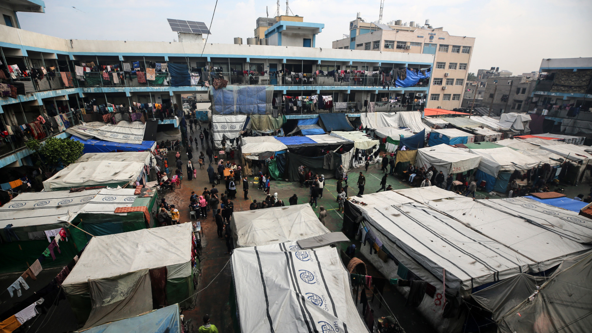 Palestinian take refuge at a UN school in Deir al-Balah in the central Gaza Strip, on 24 February 2024 (Majdi Fathi/NurPhoto via Reuters)