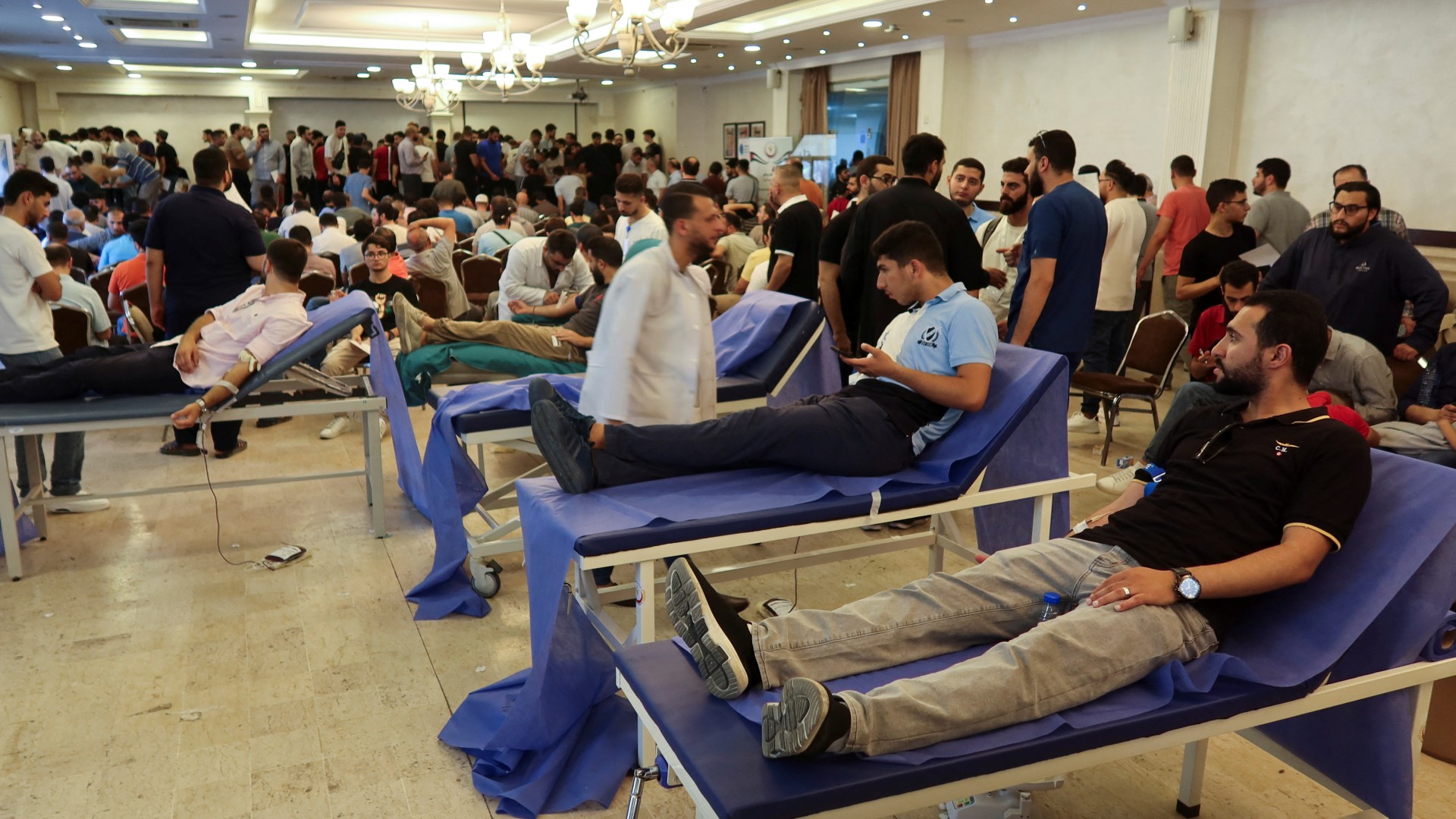 People donate blood during a blood donation campaign for Palestinians in Gaza, in Amman, Jordan June 28, 2024. REUTERS/Jehad Shelbak
