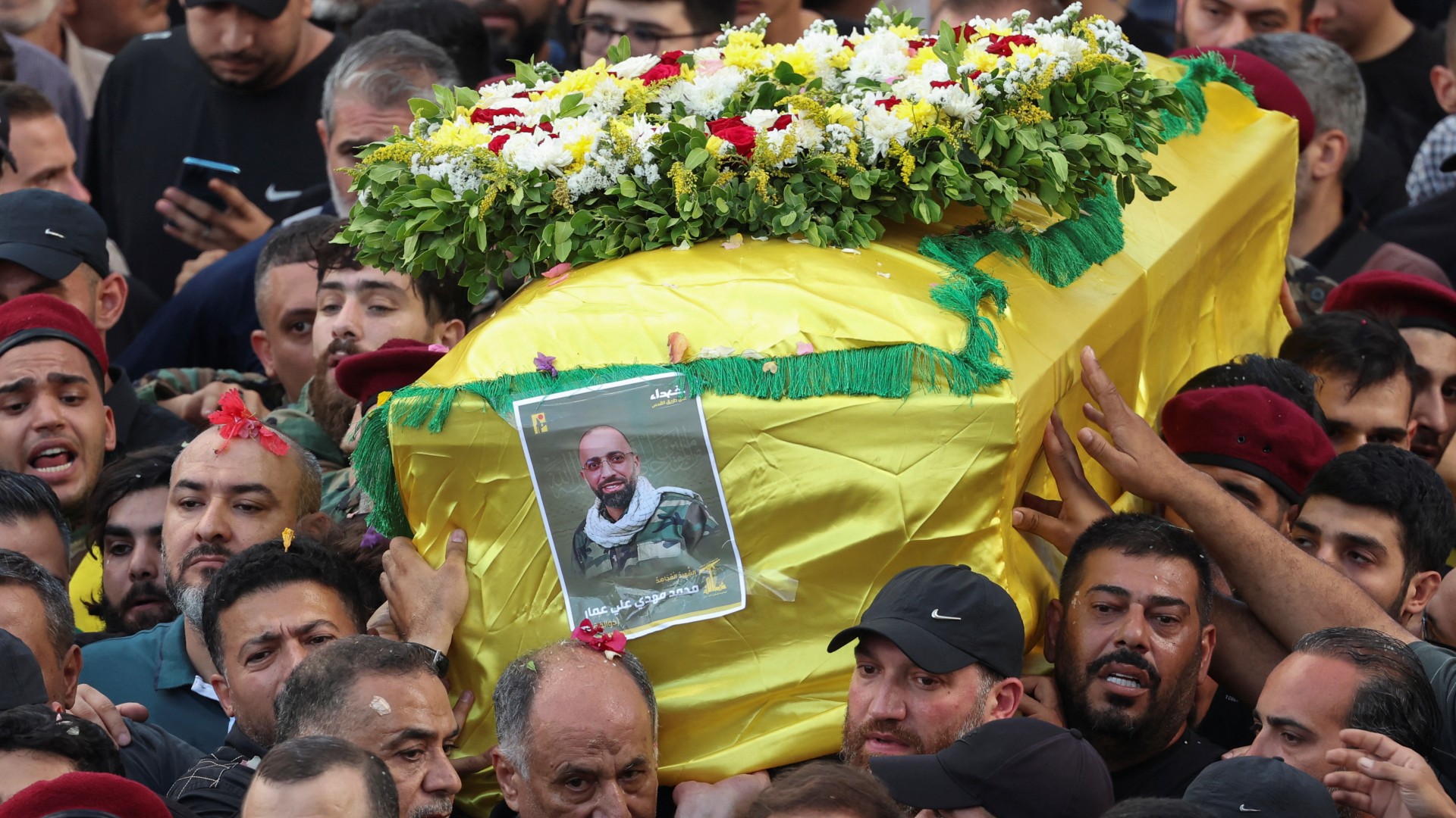 Men carry the coffin of Abbas Fadel Yassin, who was killed by the detonation of pagers across Lebanon, during his funeral in Beirut, 18 September (Reuters/Mohamed Azakir)