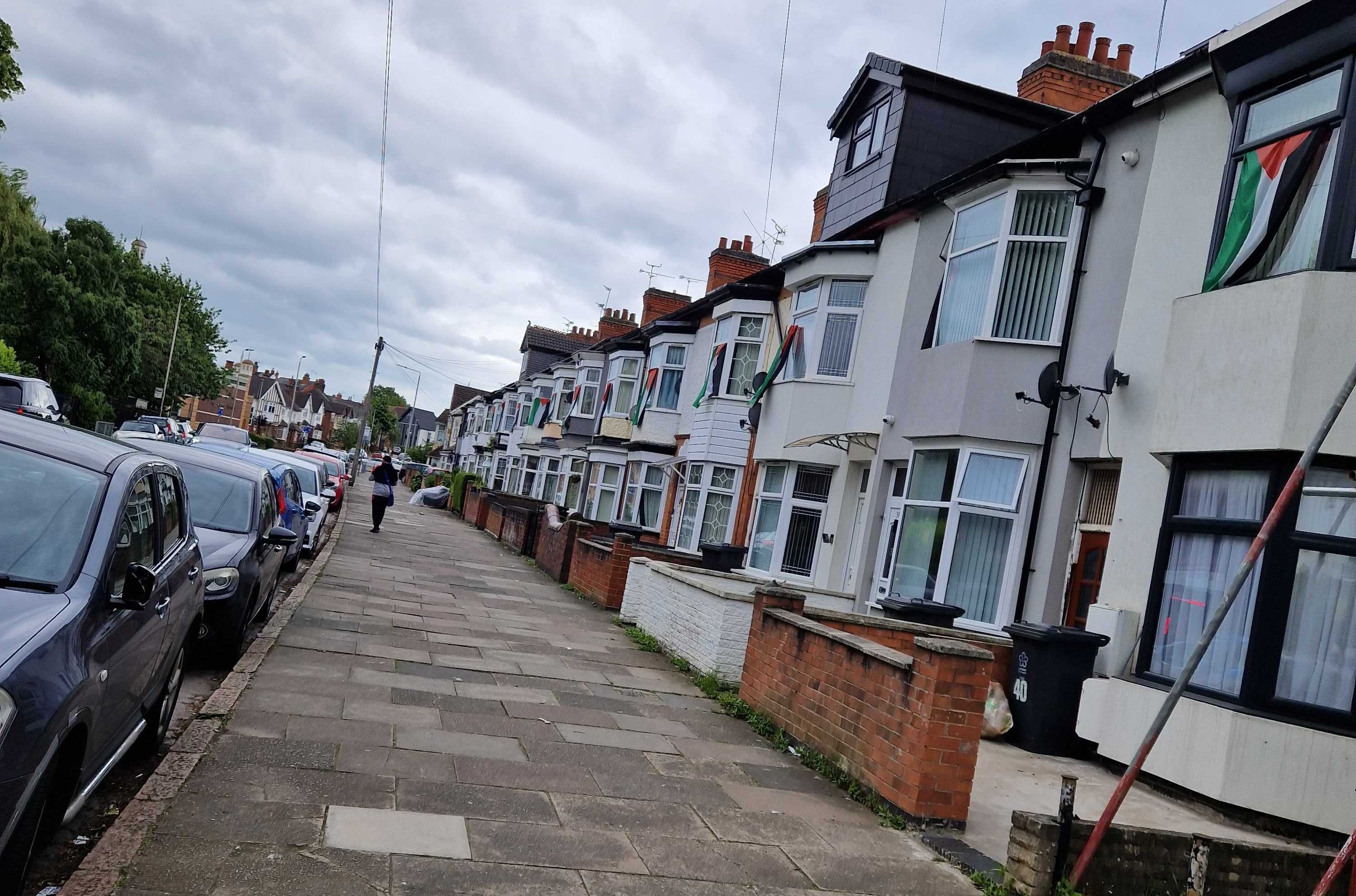 Palestine flags hang from nearly every house on Evington Valley Road