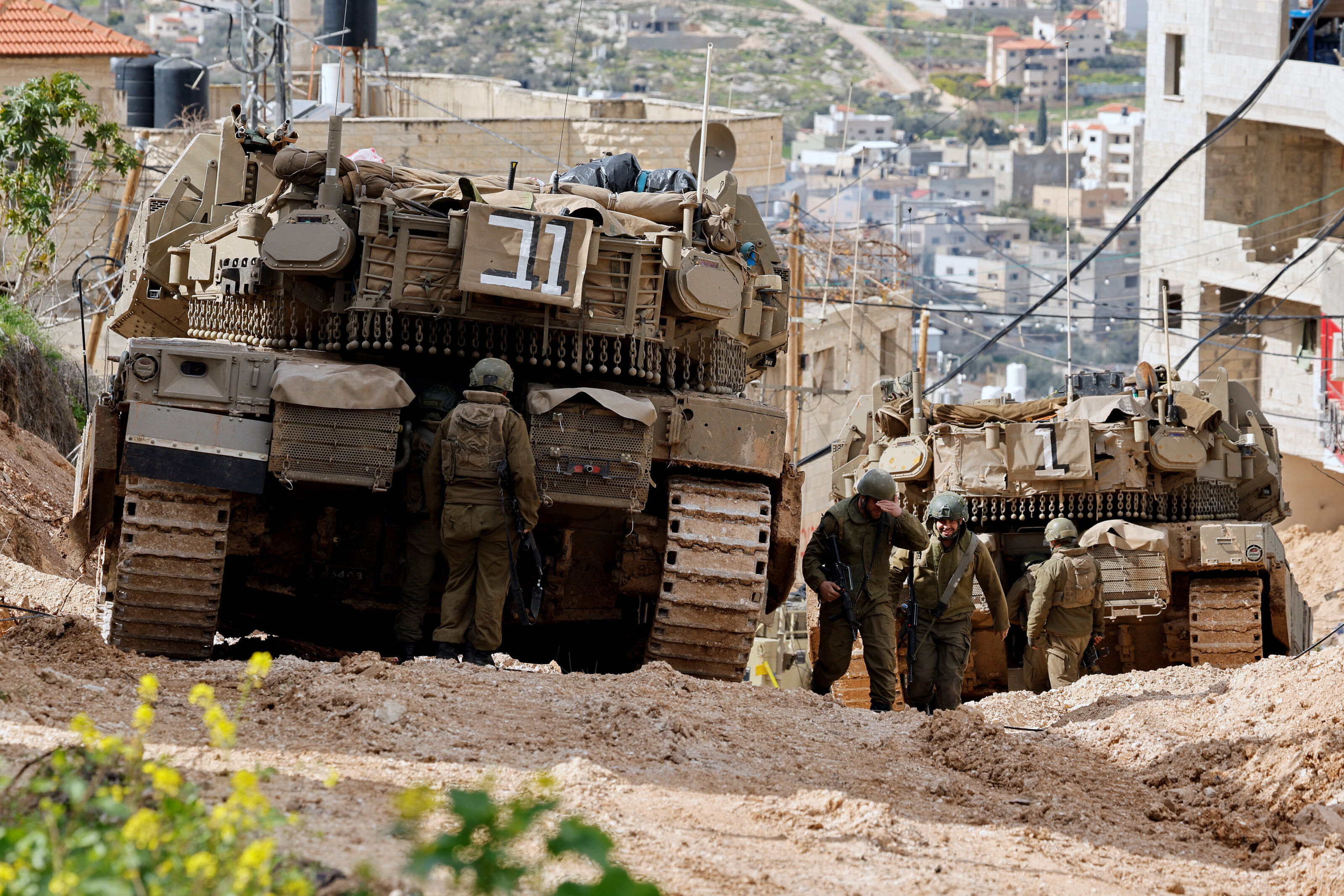 Israeli soldiers take part in an operation in Jenin, in the Israeli-occupied West Bank, February 24, 2025. REUTERS/Raneen Sawafta