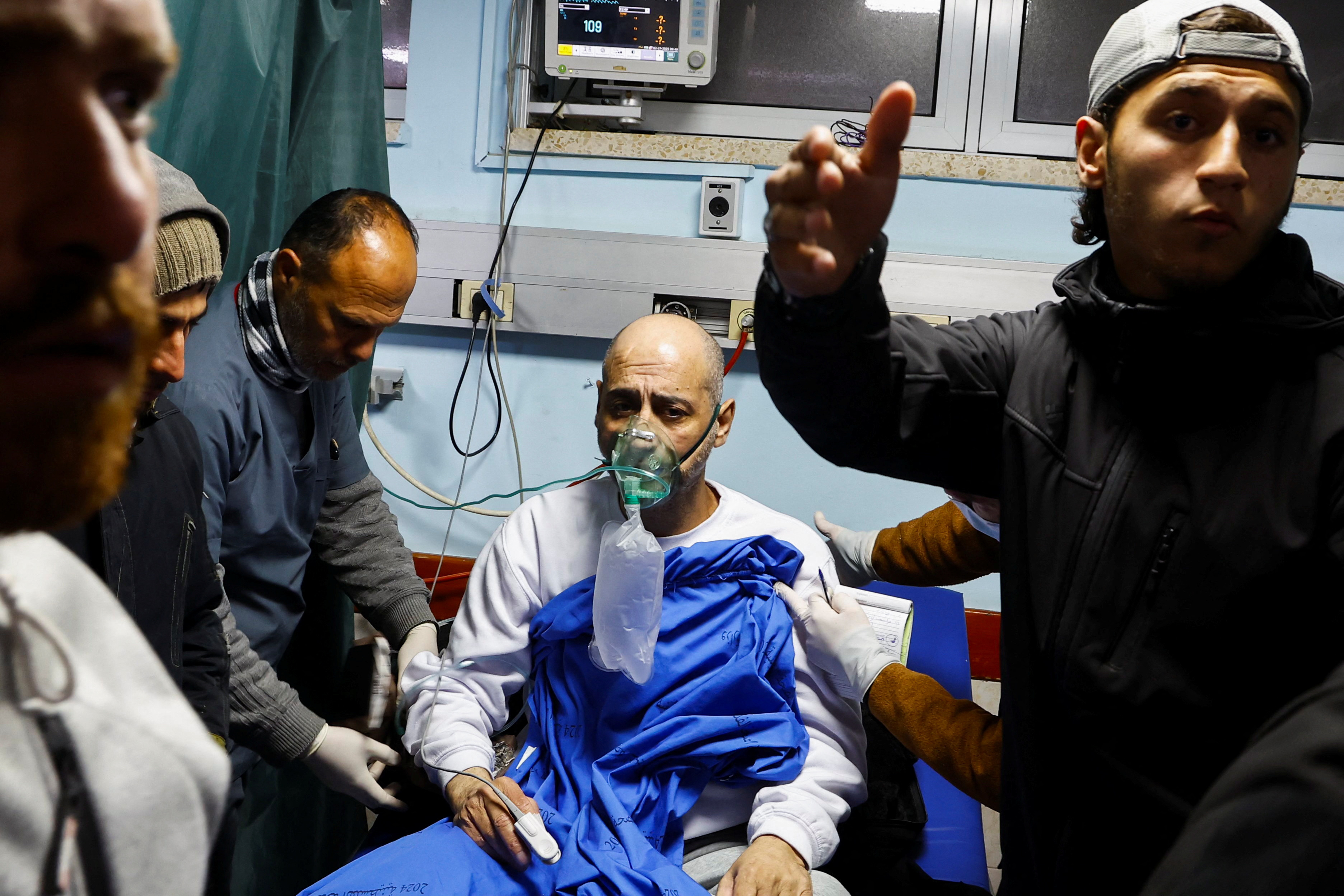 A Palestinian prisoner speaks with doctors at the European Hospital in Khan Yunis in the southern Gaza Strip early on February 27, 2025, following his release by Israeli authorities.
