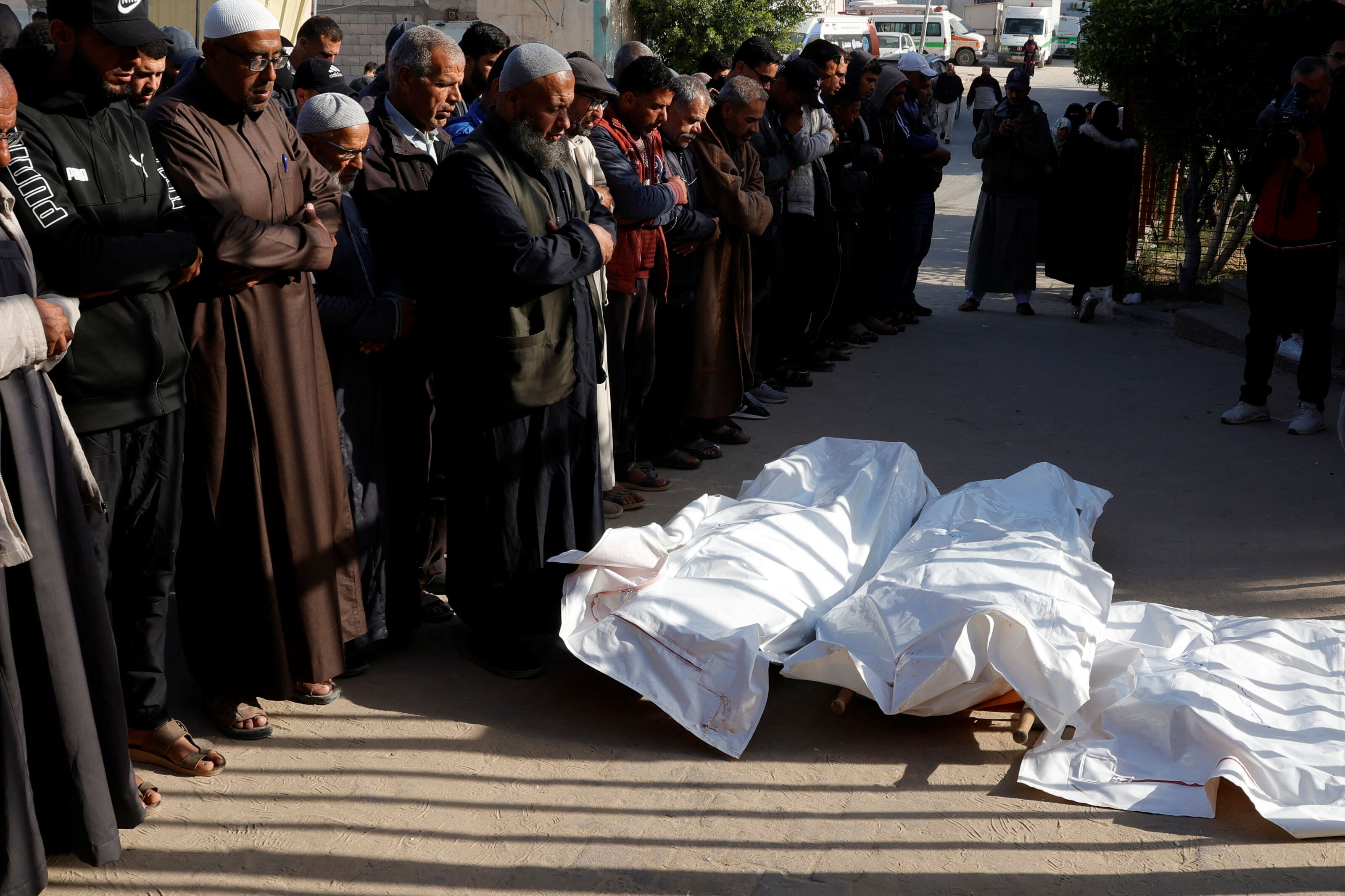 Mourners pray next to the bodies of Palestinians killed in Israeli strikes, at Nasser hospital, in Khan Younis, in the southern Gaza Strip, 15 April, 2025. (Reuters)