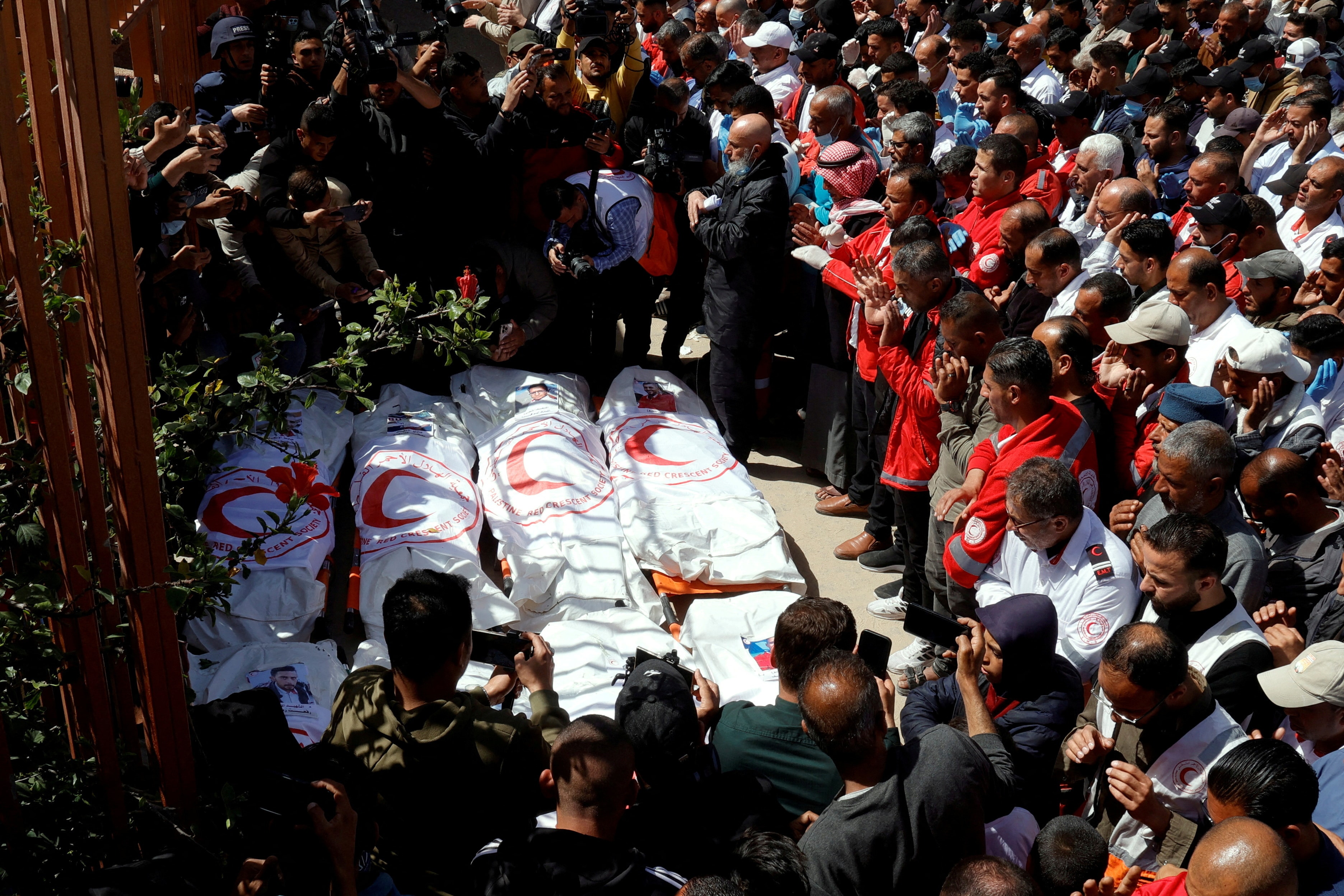  Palestinians mourn medics killed by Israeli fire while on a rescue mission, after their bodies were recovered, according to the Red Crescent, at Nasser hospital in Khan Younis in the southern Gaza Strip 31 March, 2025.