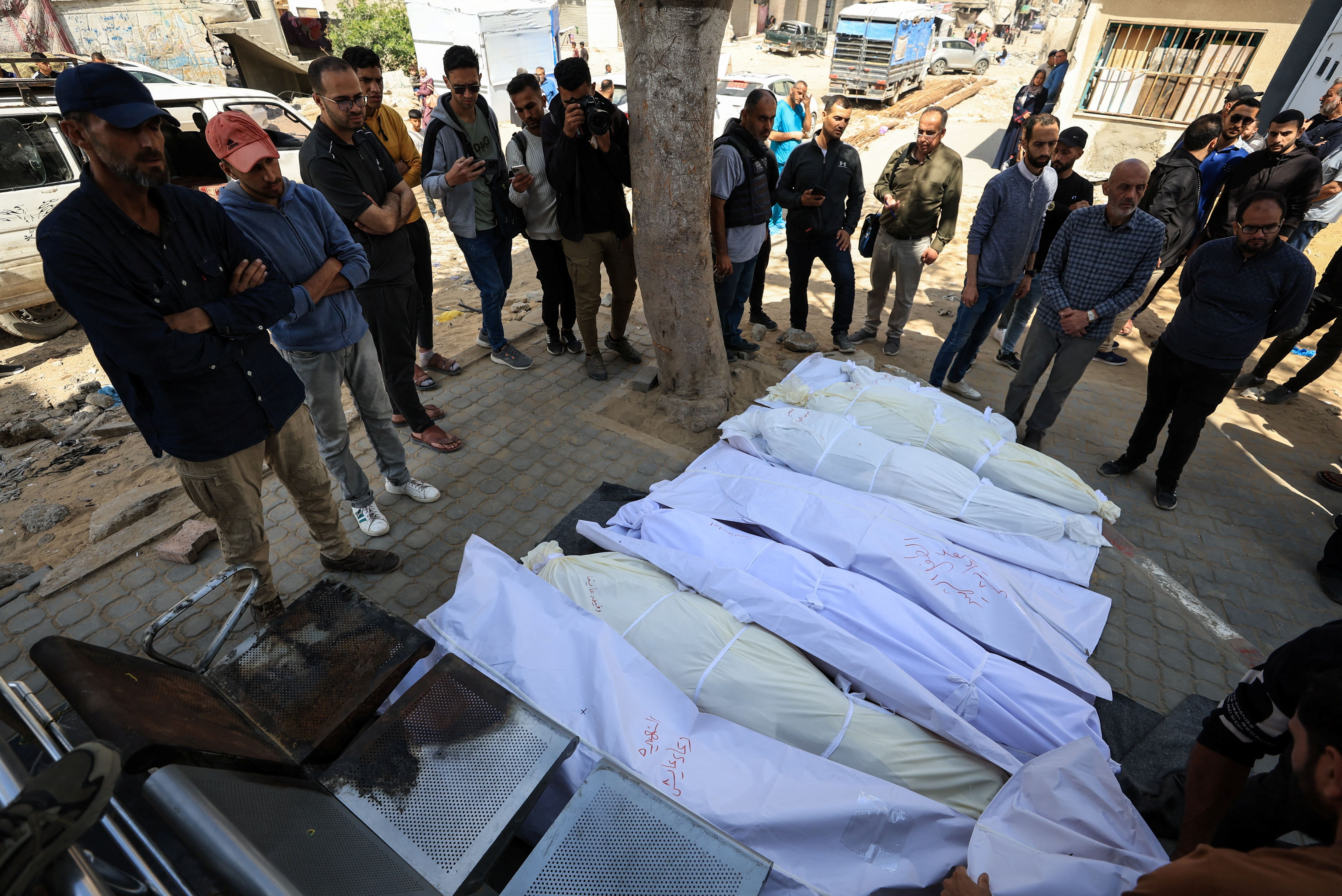 Mourners gather during the funeral of Palestinians killed in Israeli strikes, at Al Shifa hospital, in Gaza City, 5 May, 2025. (Reuters)