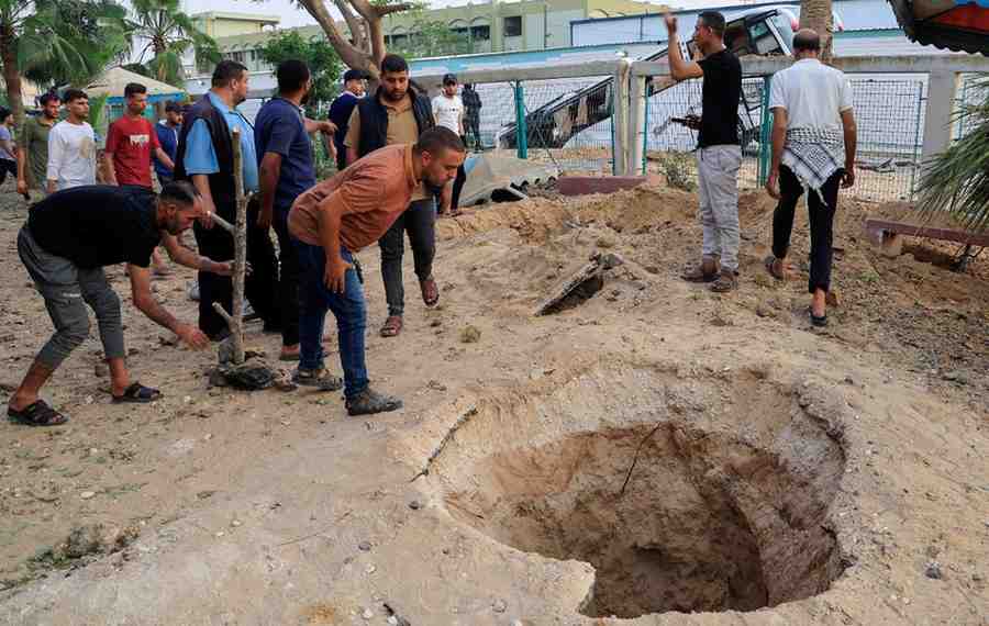 Palestinians inspect the damage, after the European Hospital was partially damaged following Israeli airstrikes, according to the Gaza Health Ministry, in Khan Younis, in the southern Gaza Strip, May 13, 2025. REUTERS