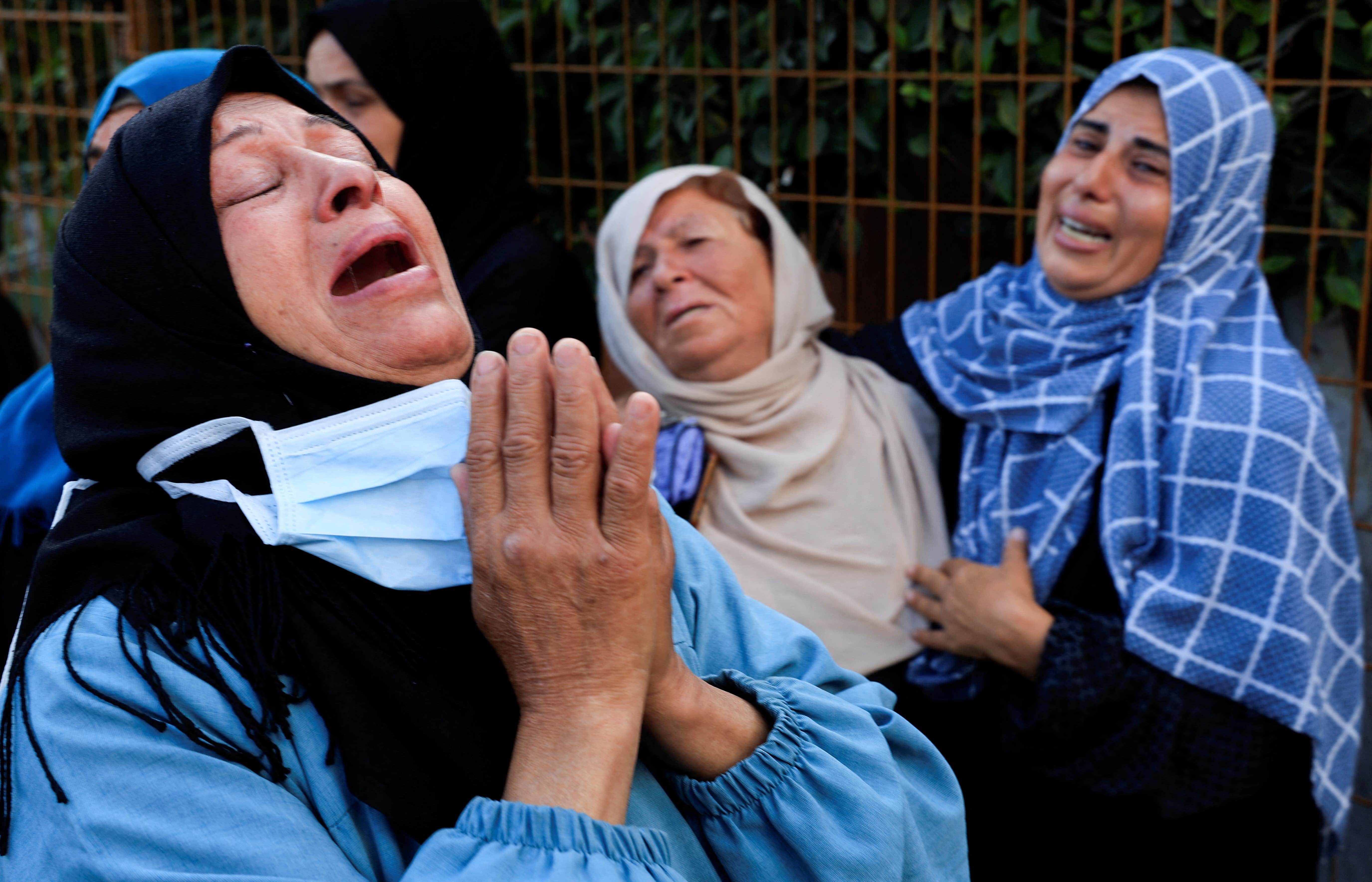 Mourners react during the funeral of Palestinians who, according to medics, were killed in Israeli strikes, at Nasser hospital, in Khan Younis, in the southern Gaza Strip, June 2, 2025. 