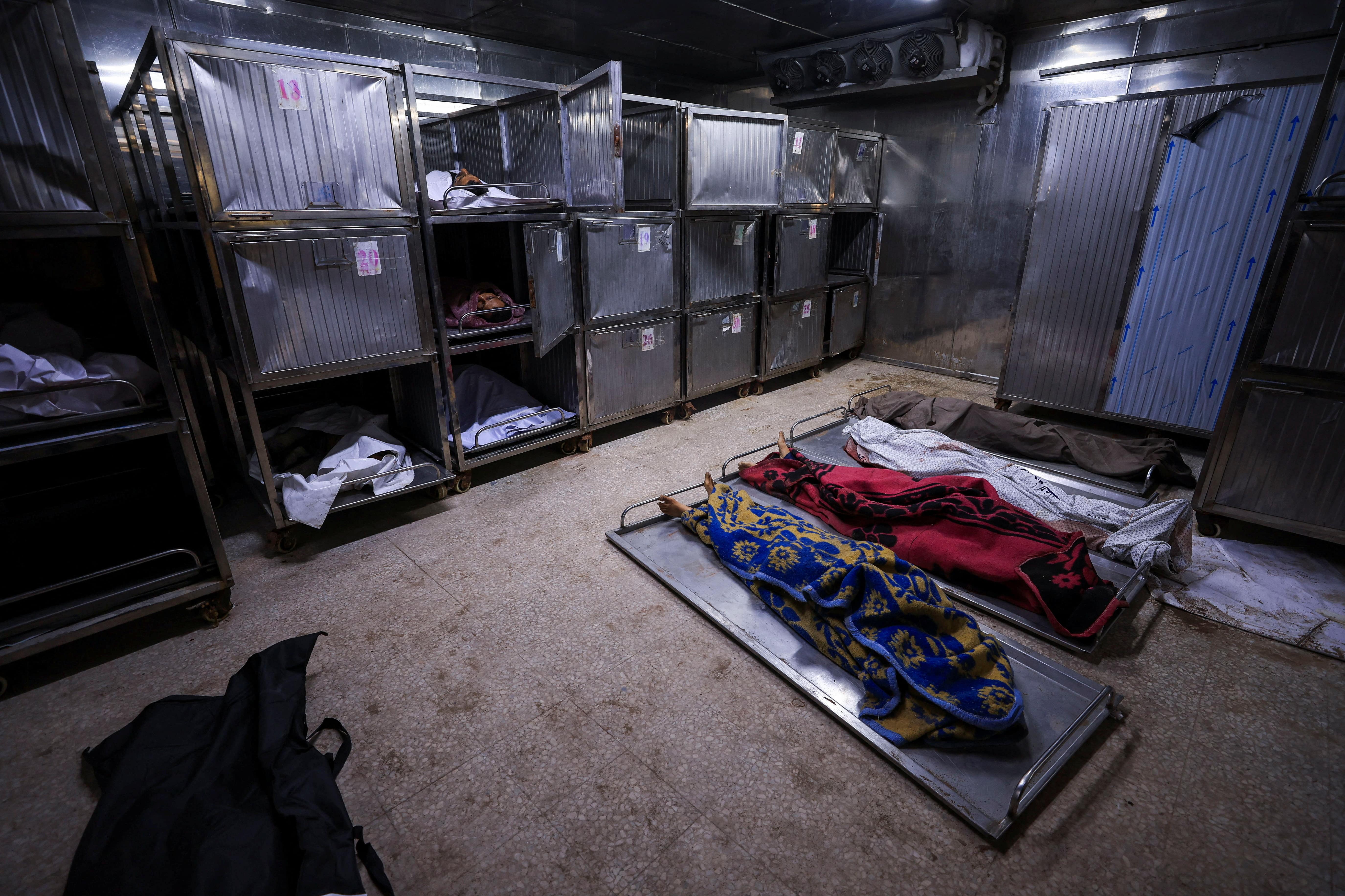 Bodies of Palestinians who were killed, according to medics, in Israeli strikes, lie at Al-Shifa hospital, in Gaza City, June 4, 2025. REUTERS