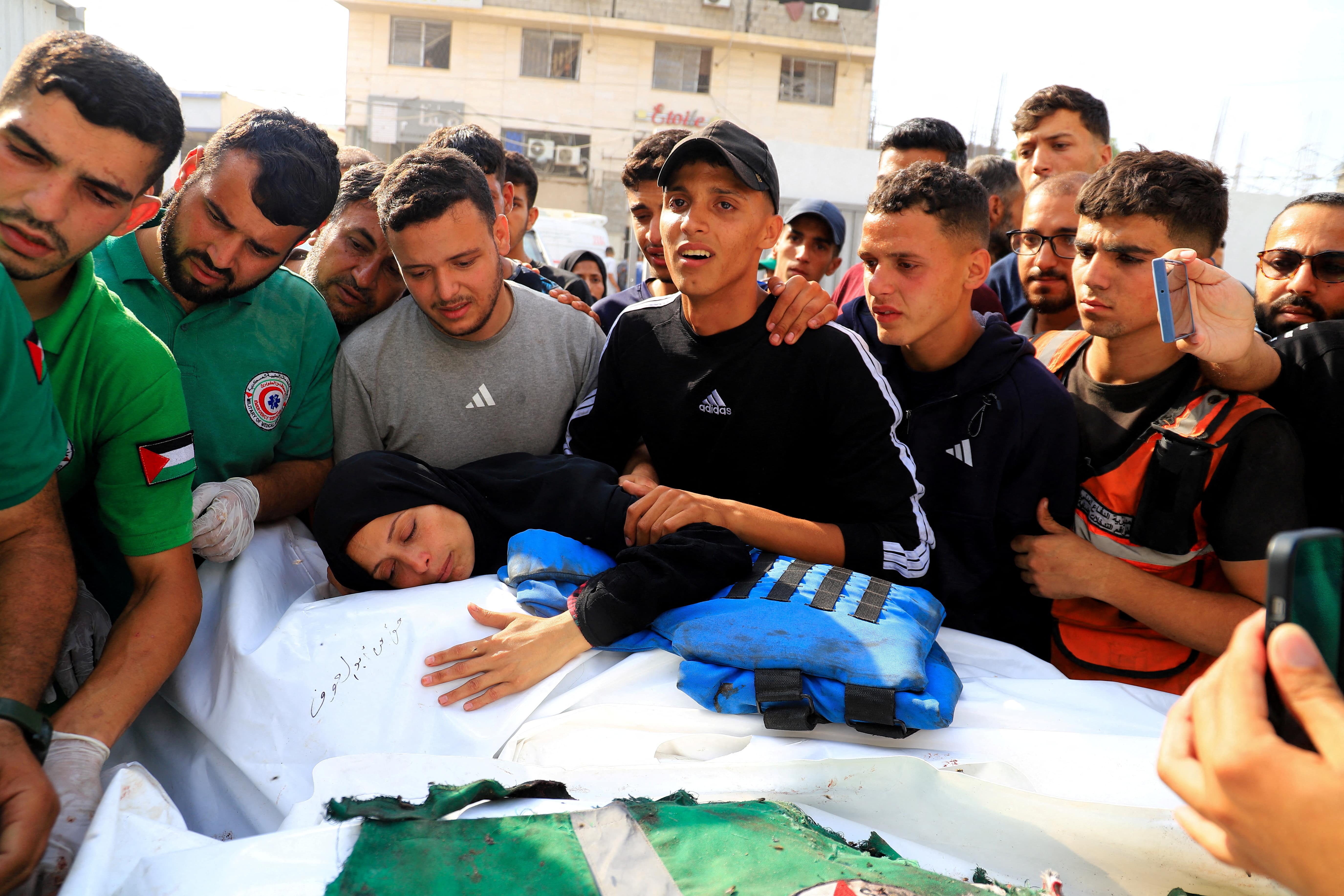 Mourners attend the funeral of a journalist and three Palestinian medics killed in an Israeli airstrike, according to the health ministry, in Gaza City, June 10, 2025. REUTERS