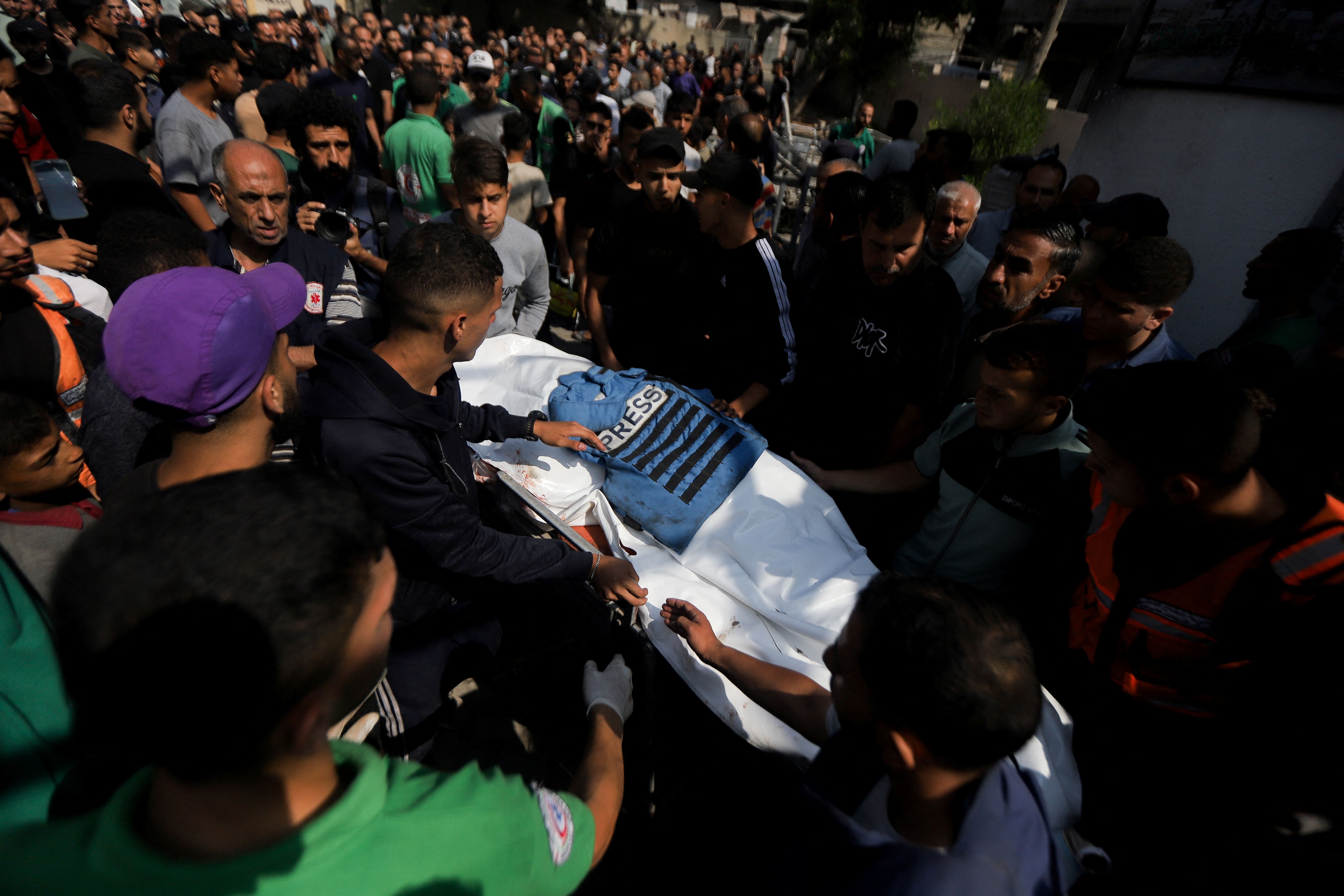 Mourners attend the funeral of a journalist and three Palestinian medics killed in an Israeli airstrike, according to the health ministry, in Gaza City, June 10, 2025. REUTERS