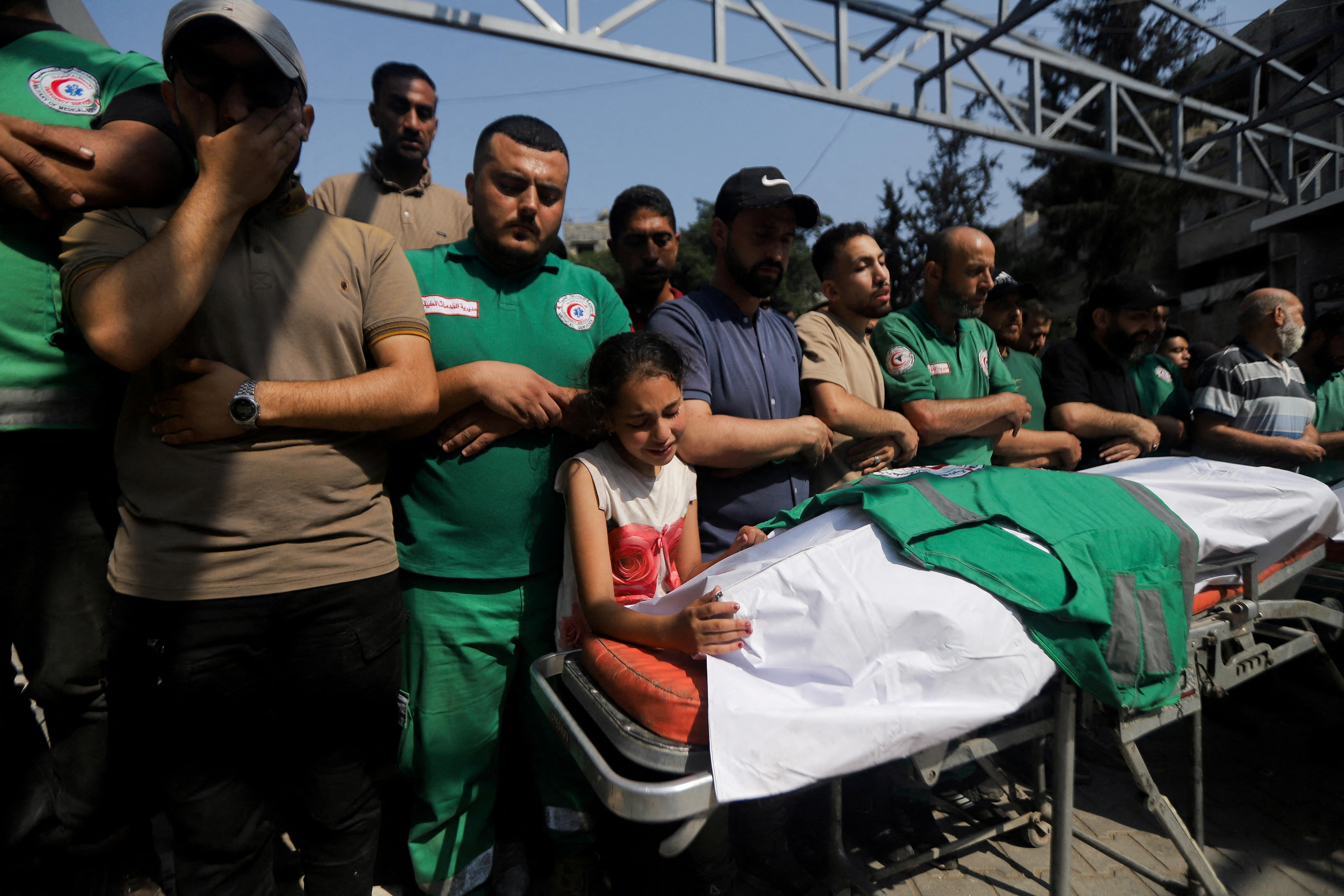 Mourners attend the funeral of a journalist and three Palestinian medics killed in an Israeli airstrike, according to the health ministry, in Gaza City, June 10, 2025. REUTERS