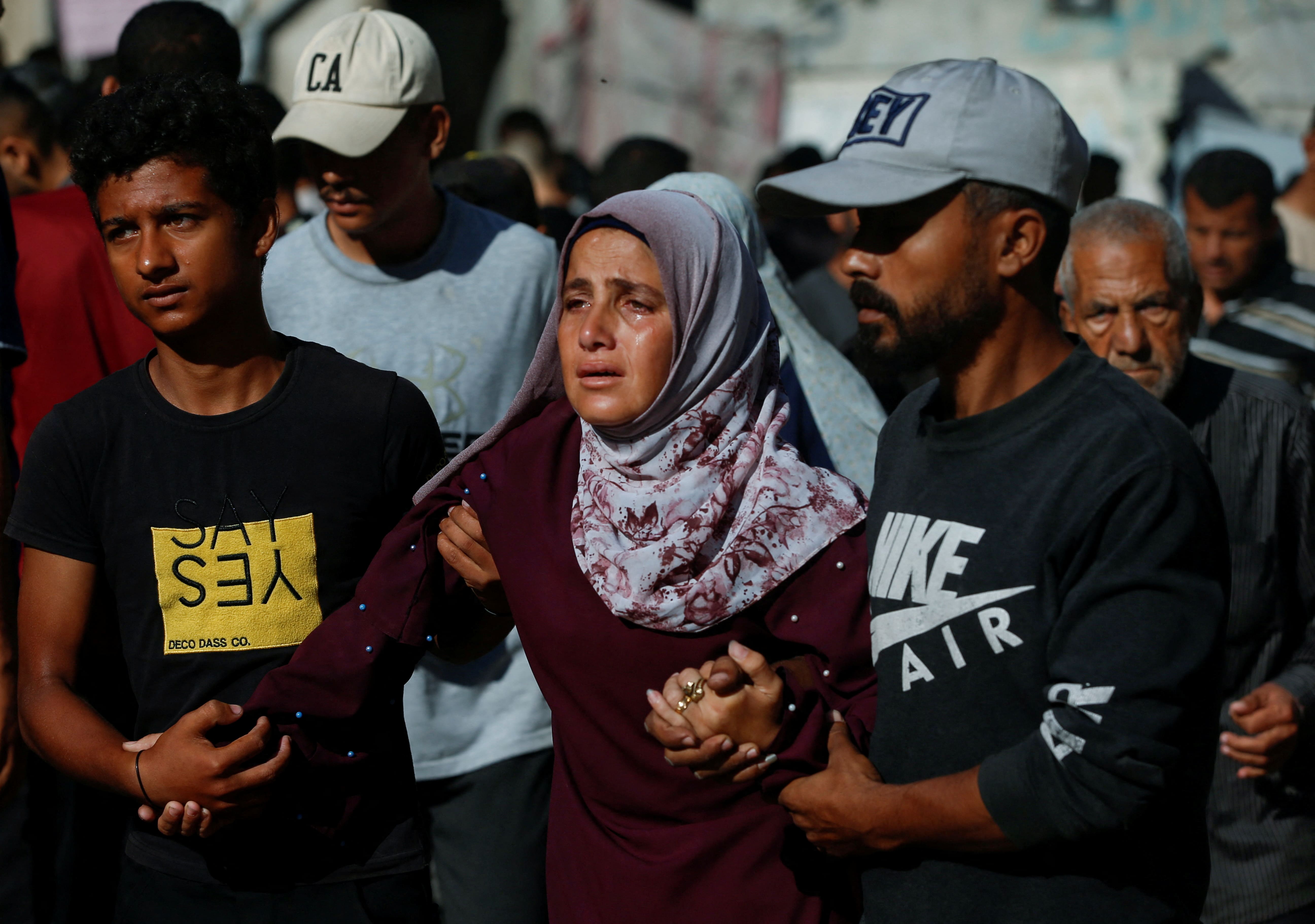 Mourners attend the funeral of Palestinians killed on Wednesday in what the Gaza Health Ministry described as an Israeli airstrike on a house, at Al-Shifa Hospital in Gaza City, June 26, 2025. 