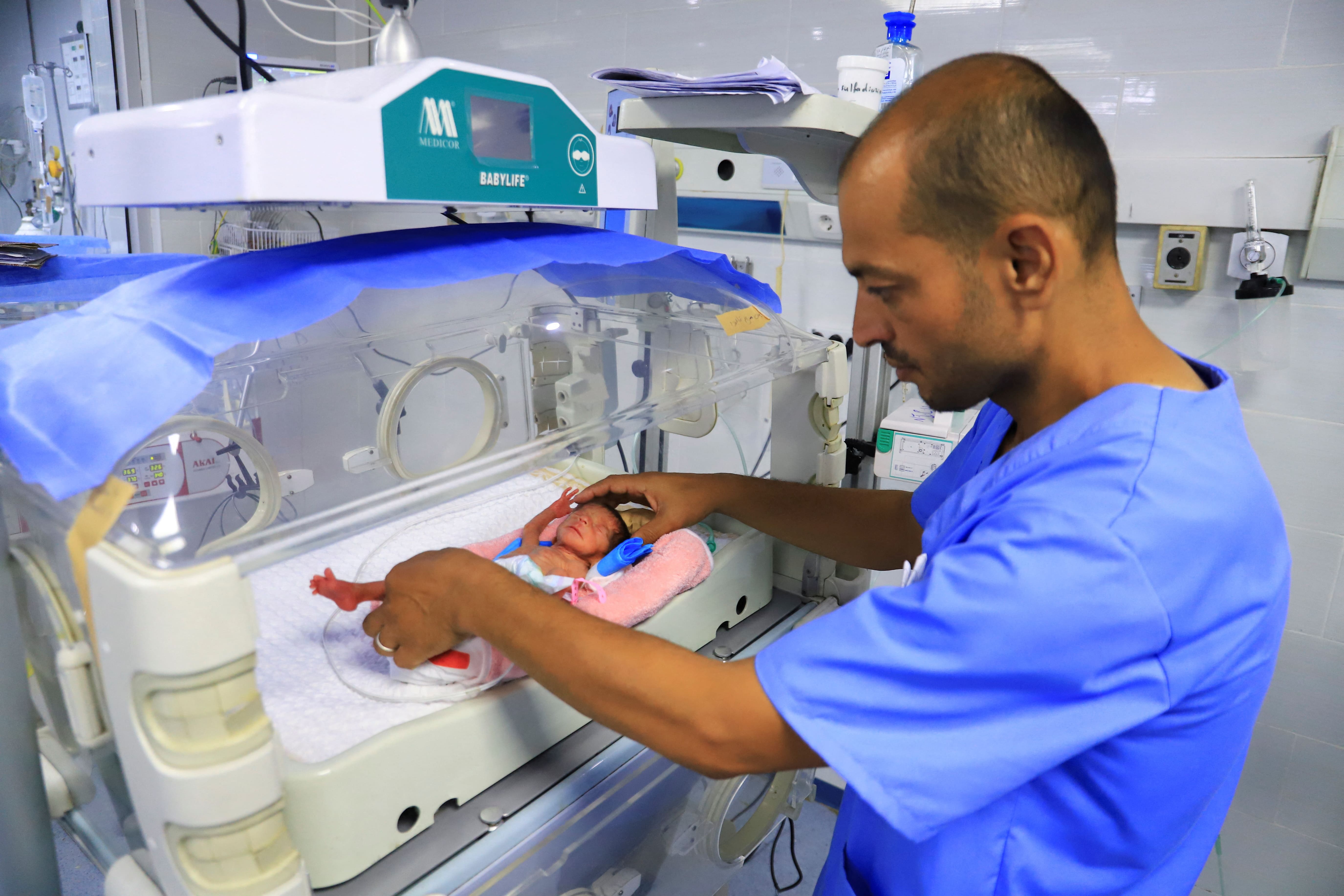 A premature baby lies in an incubator at Al-Helou Hospital, where doctors say a shortage of specialised formula milk is threatening the lives of newborns, in Gaza City, June 25, 2025. 